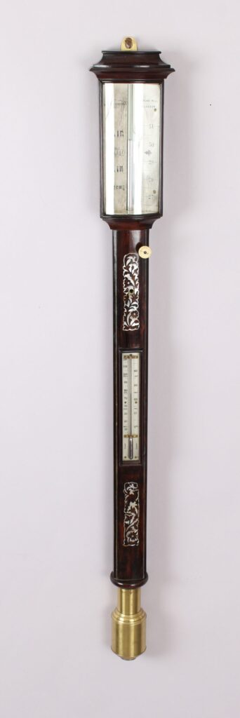 A bow-fronted marine barometer in a well-figured rosewood case