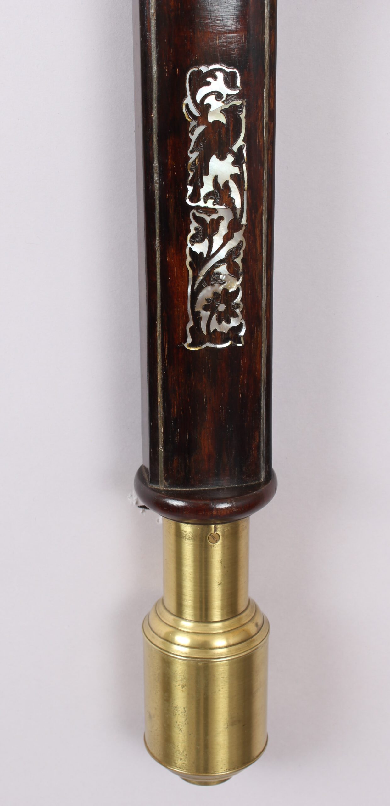 A bow-fronted marine barometer in a well-figured rosewood case