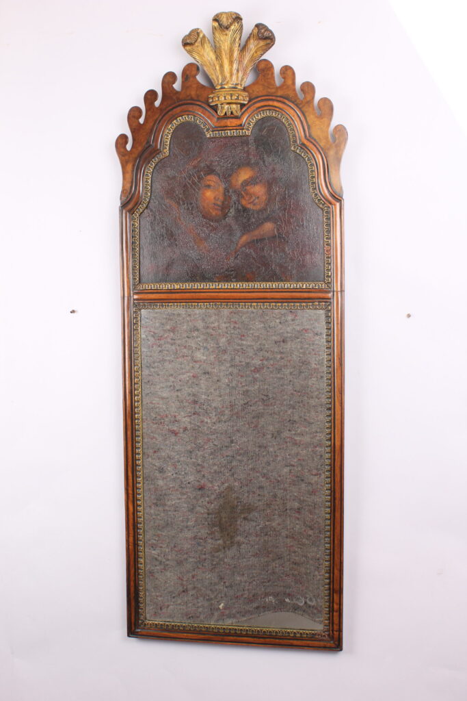 Walnut and gilt mirror with a painted panel