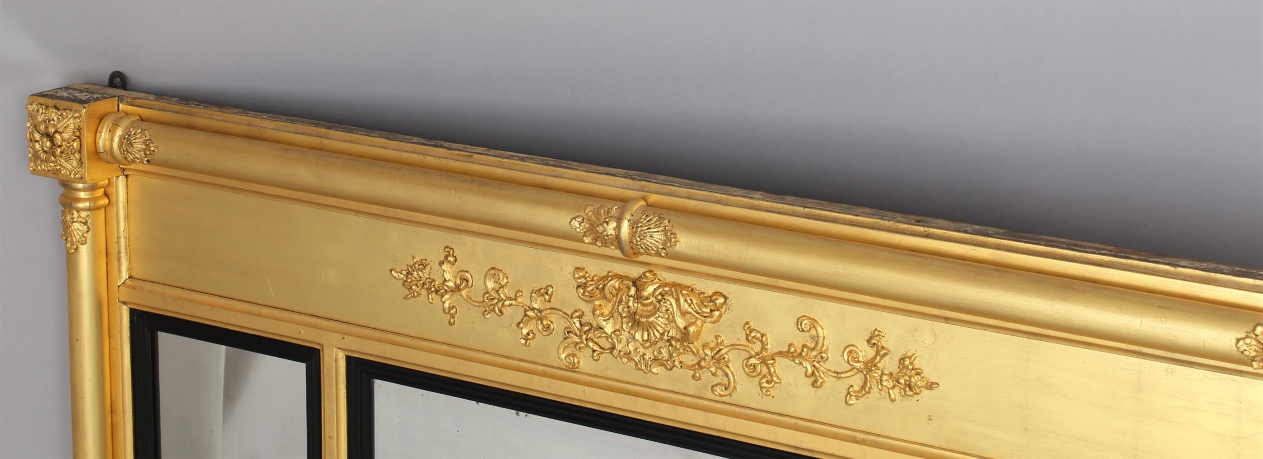 A Regency triple plate gilt overmantle mirror