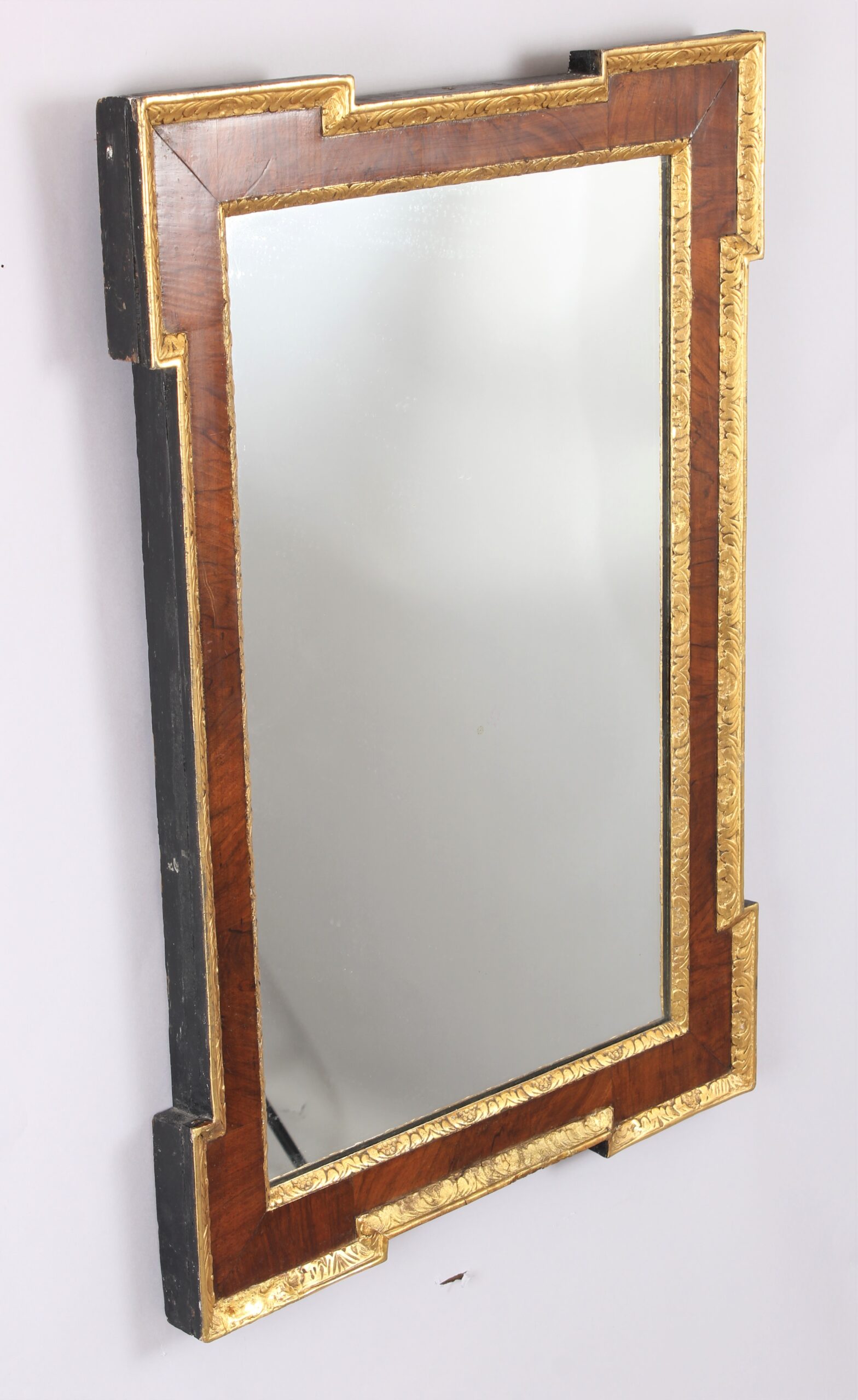 An 18th century walnut and gilt slip rectangular mirror