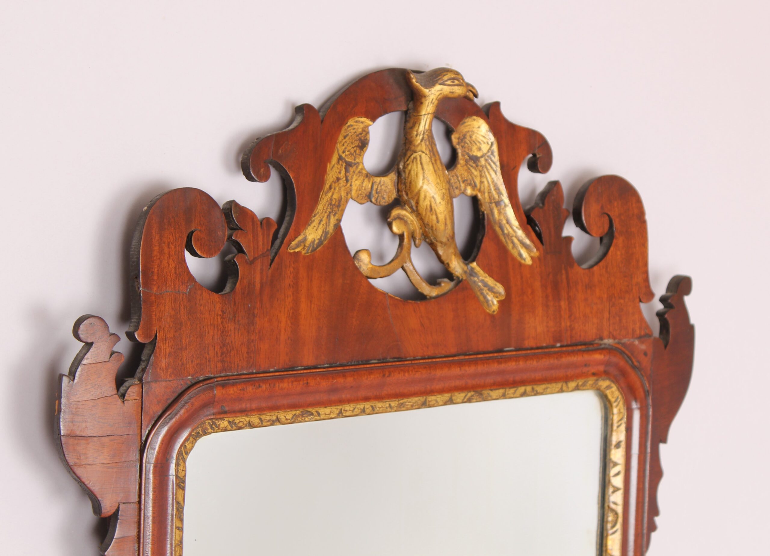 A mahogany `bird` mirror in the rococo taste