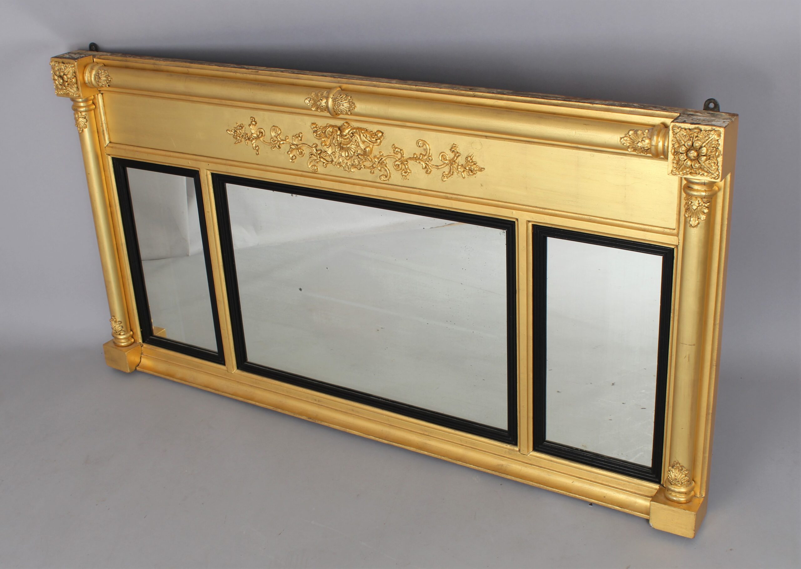 A Regency triple plate gilt overmantle mirror