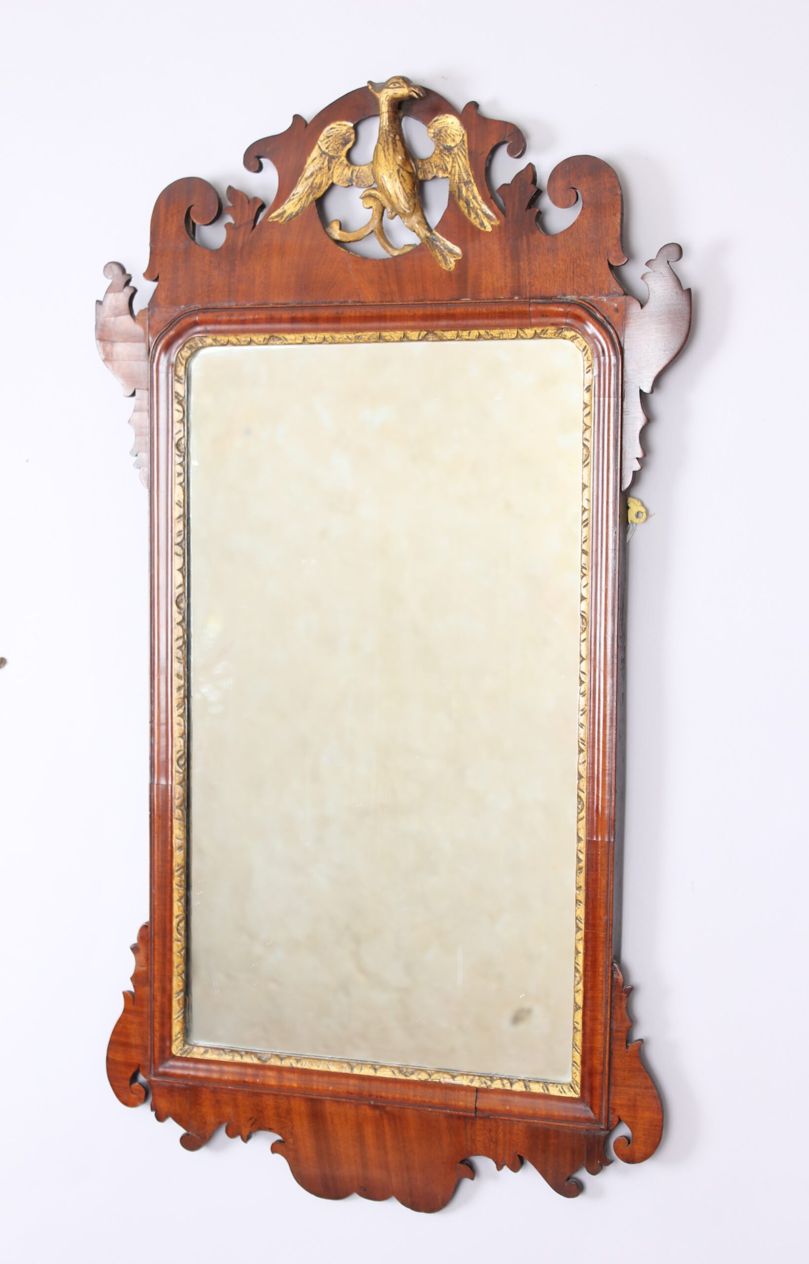 A mahogany `bird` mirror in the rococo taste