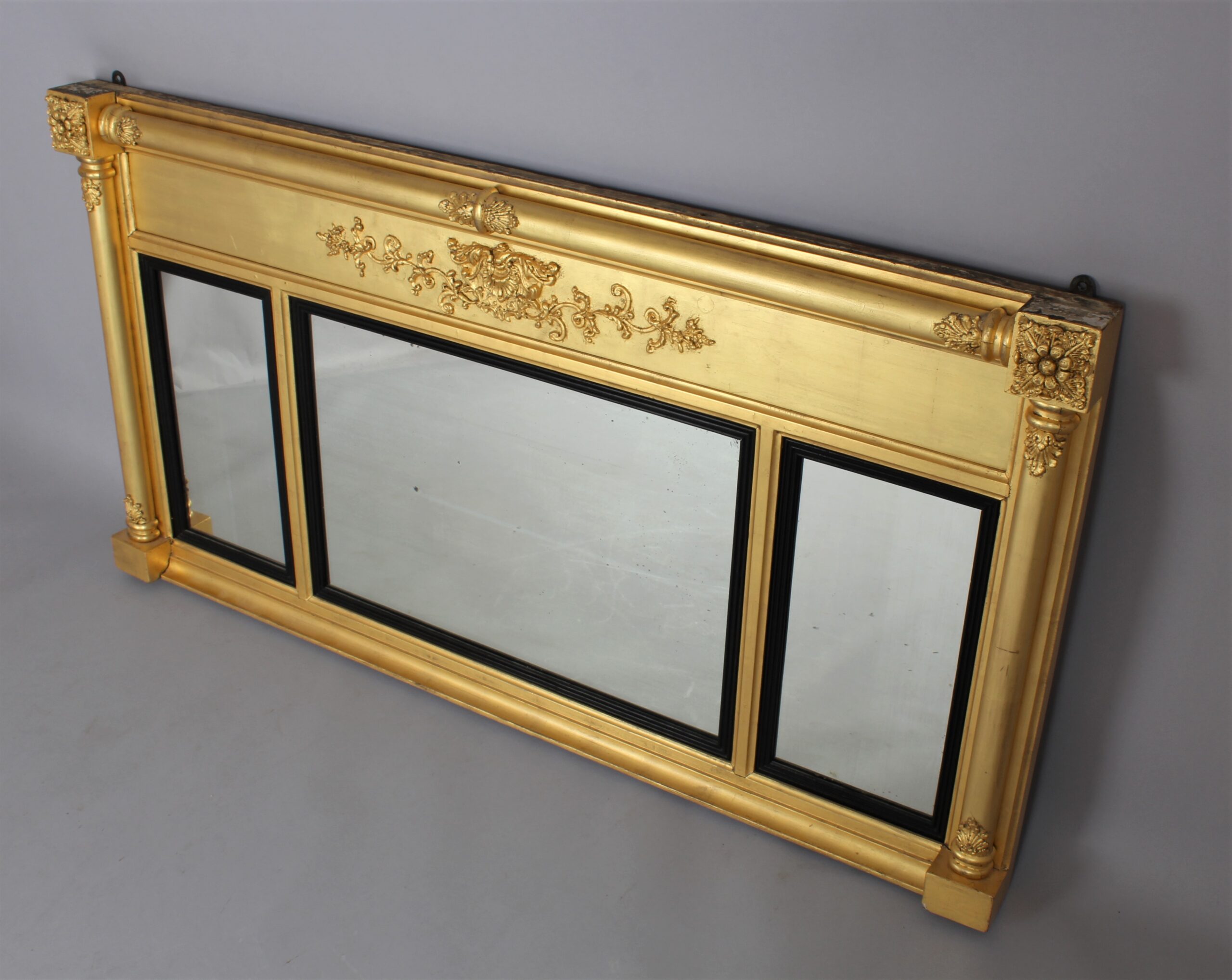A Regency triple plate gilt overmantle mirror
