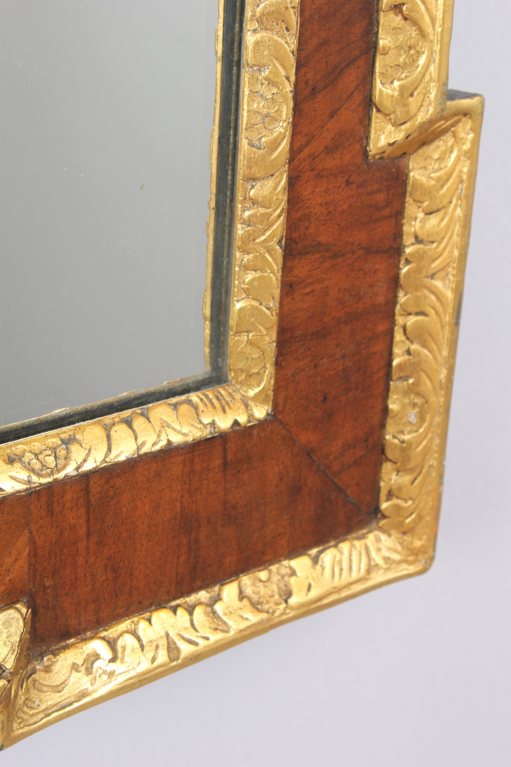 An 18th century walnut and gilt slip rectangular mirror