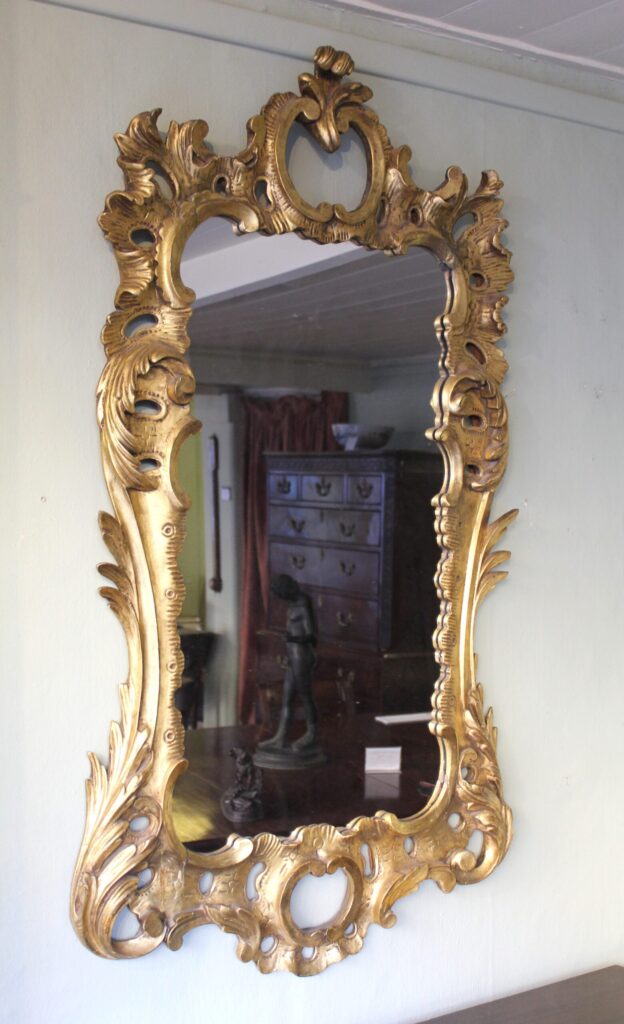 A carved and gilt wood mirror in the manner of Matthias Lock (c1710 – 1765)