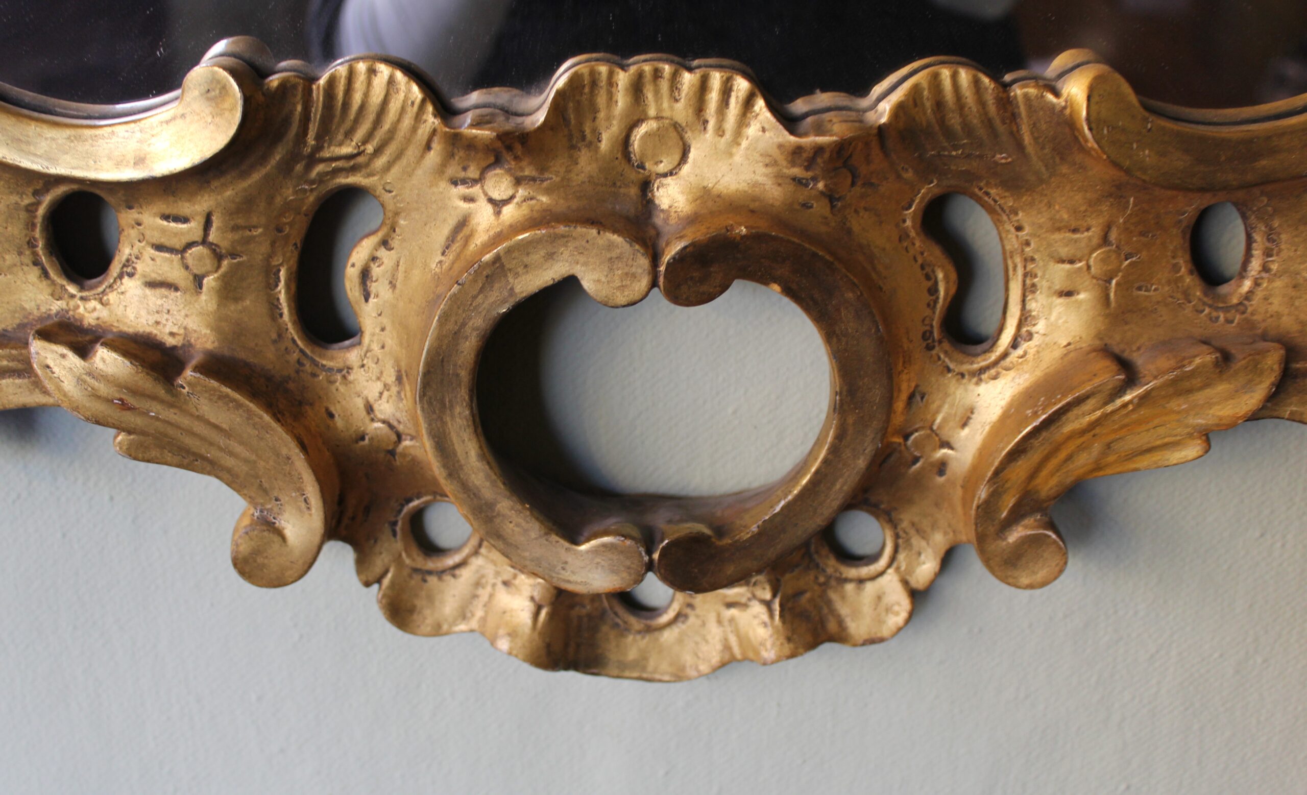 A carved and gilt wood mirror in the manner of Matthias Lock (c1710 – 1765)