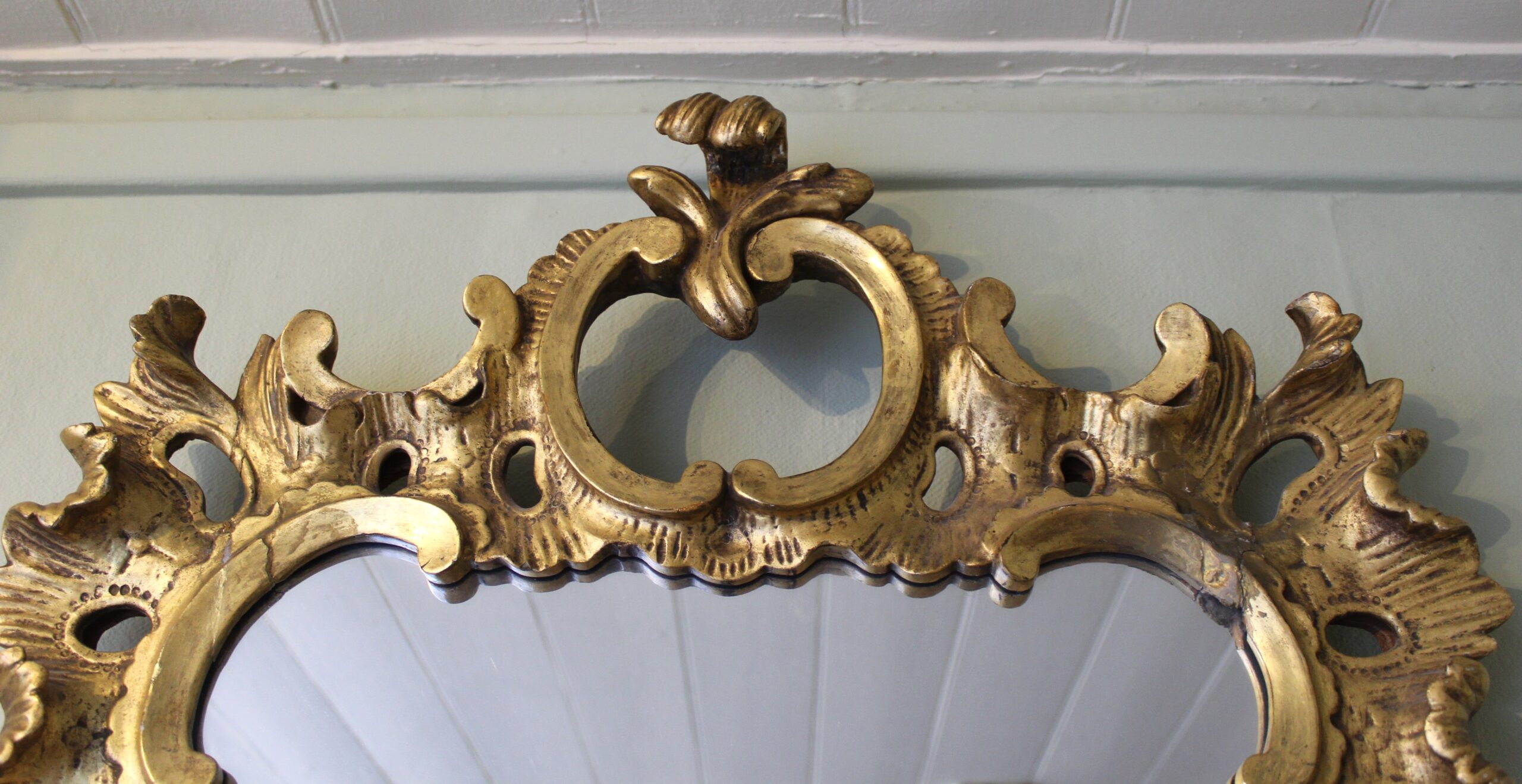A carved and gilt wood mirror in the manner of Matthias Lock (c1710 – 1765)