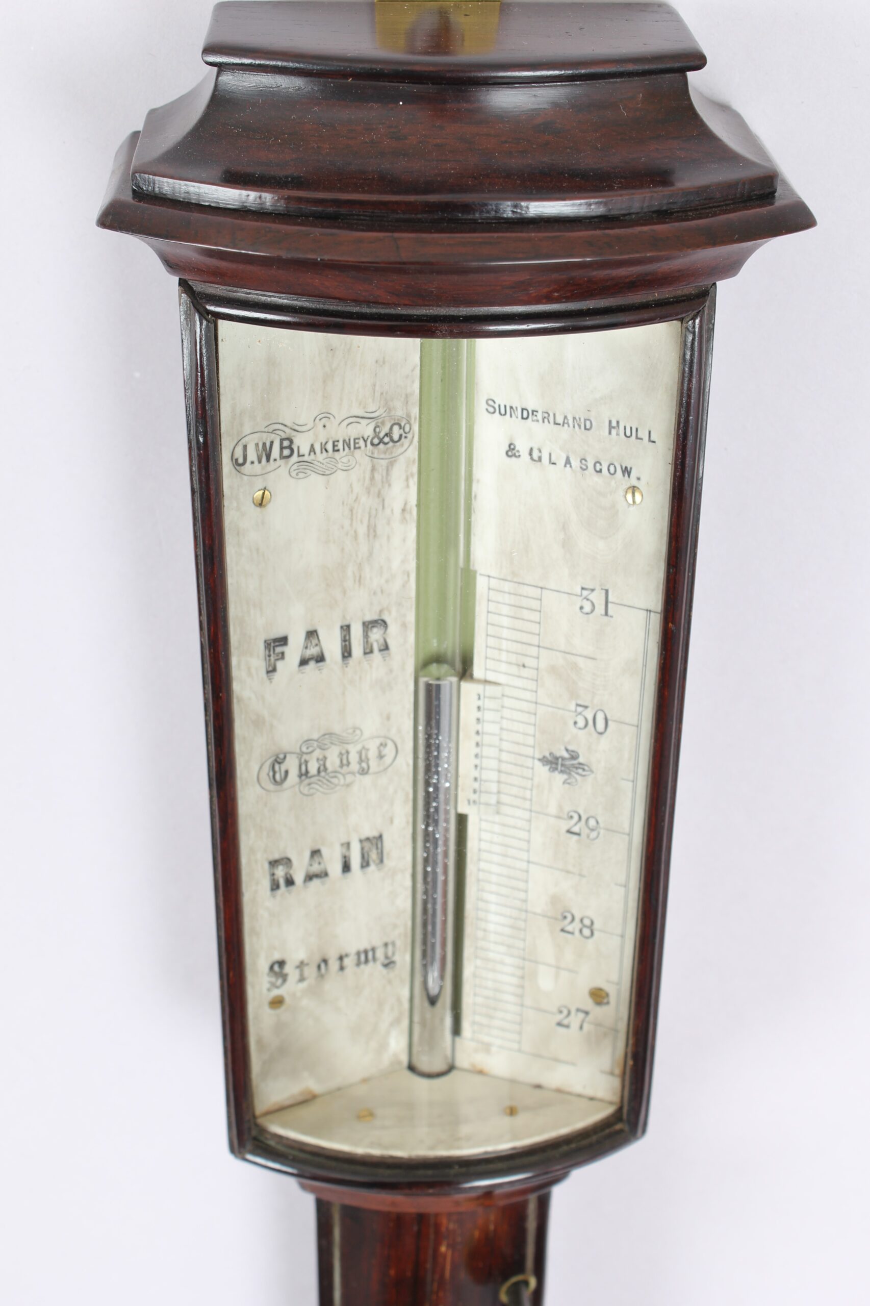 A bow-fronted marine barometer in a well-figured rosewood case