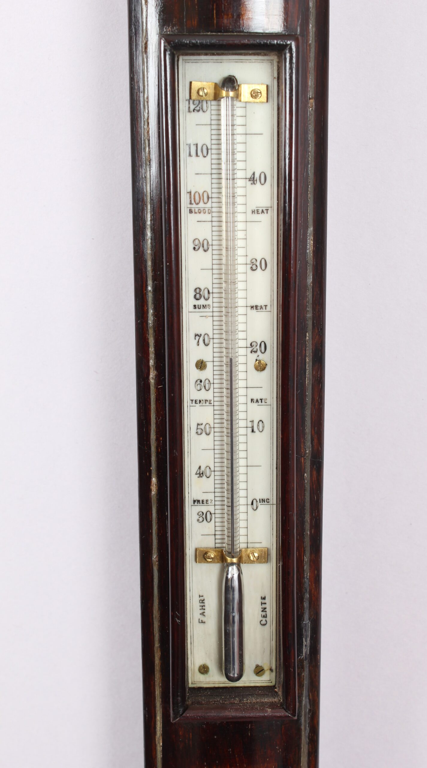 A bow-fronted marine barometer in a well-figured rosewood case