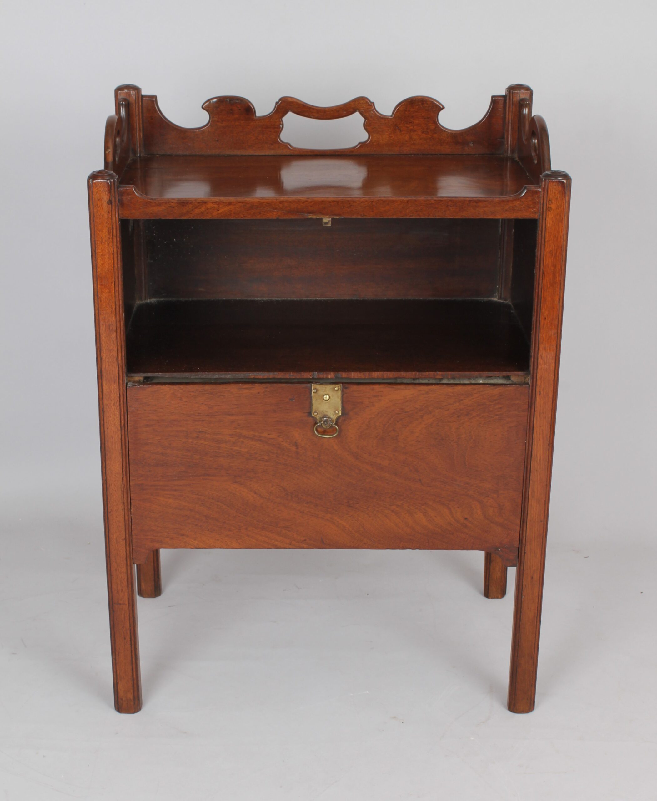 An unusual George III period mahogany night table