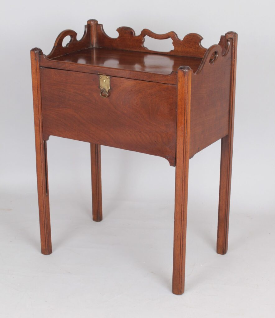 An unusual George III period mahogany night table