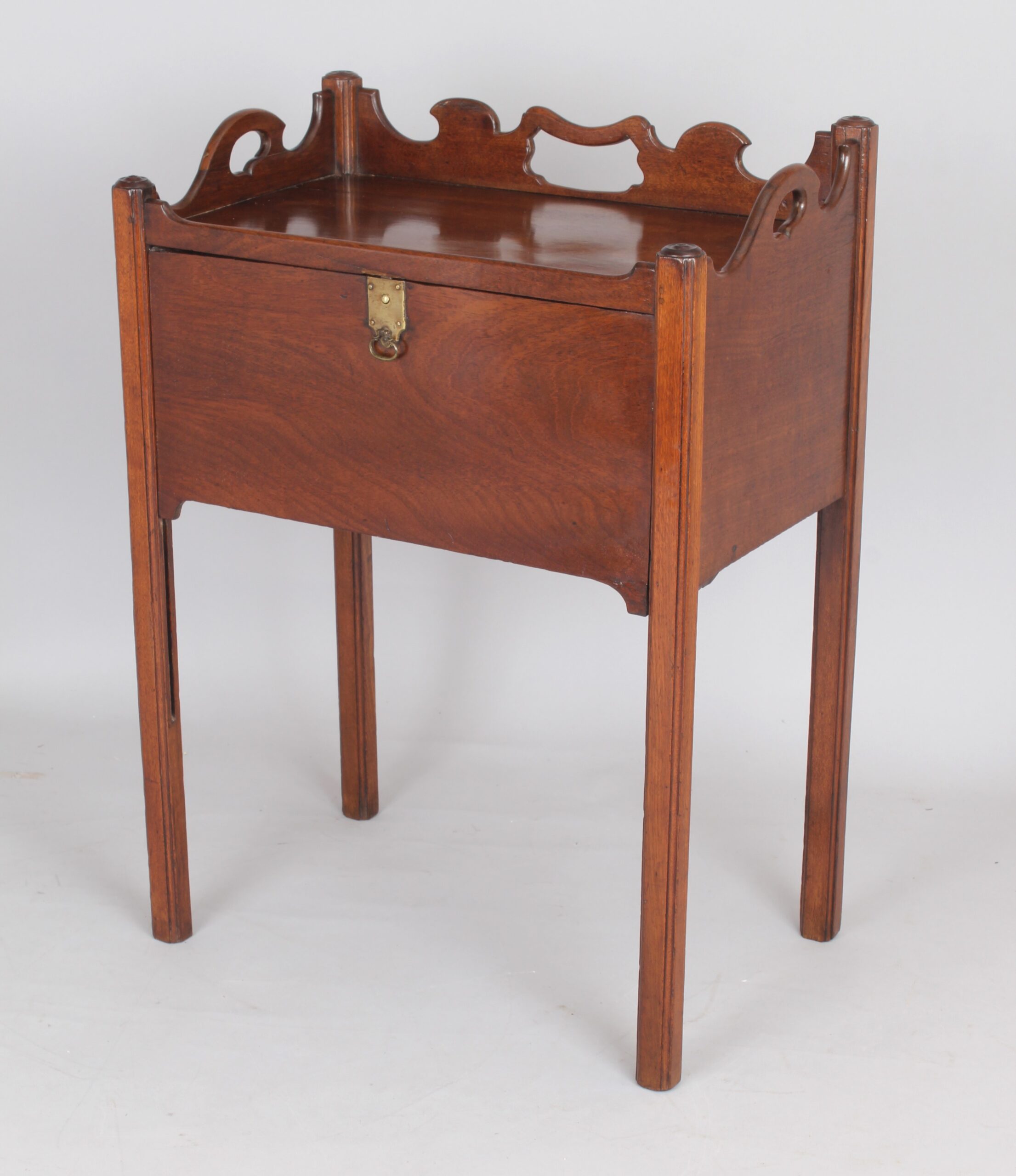 An unusual George III period mahogany night table