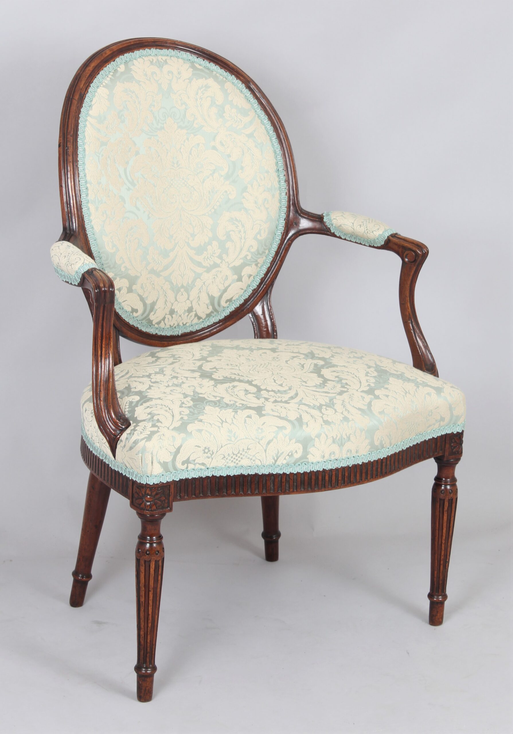 A George III mahogany lady’s open armchair