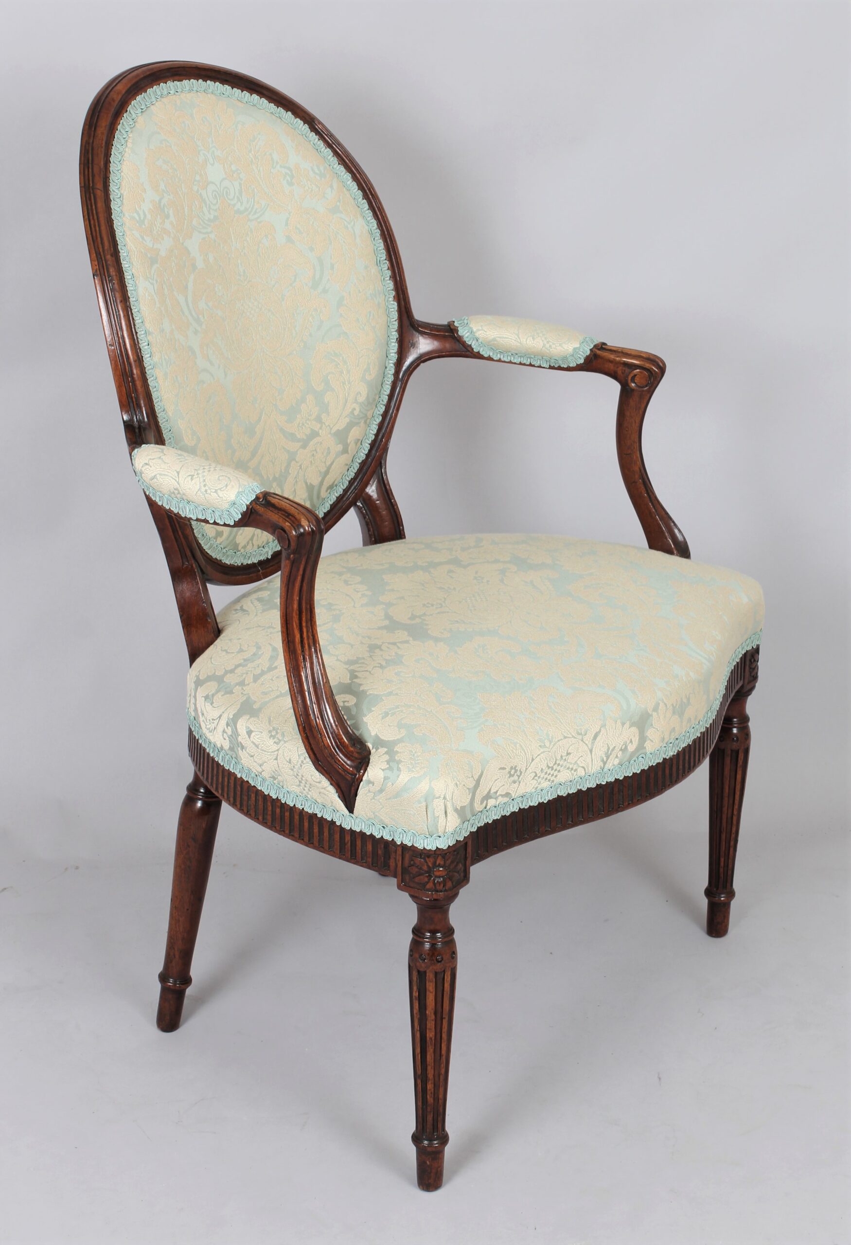 A George III mahogany lady’s open armchair