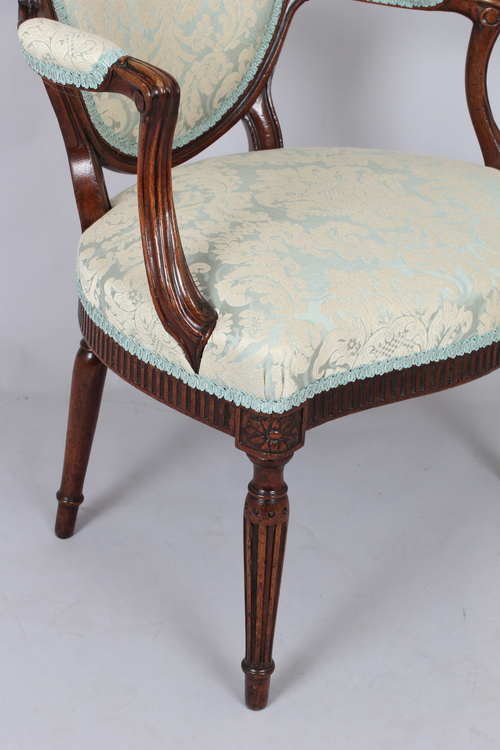A George III mahogany lady’s open armchair
