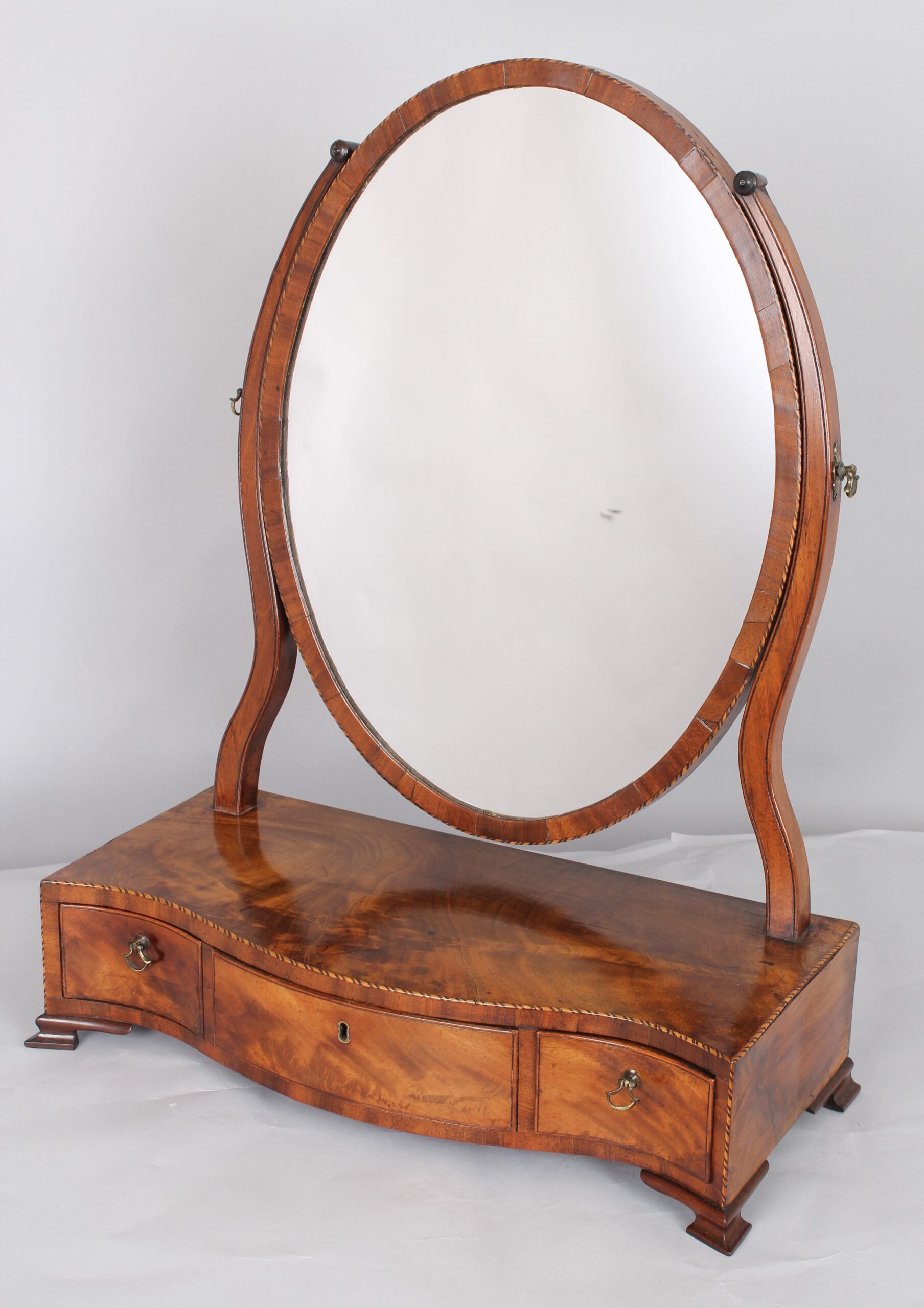George III period mahogany toilet mirror of good figure and colour
