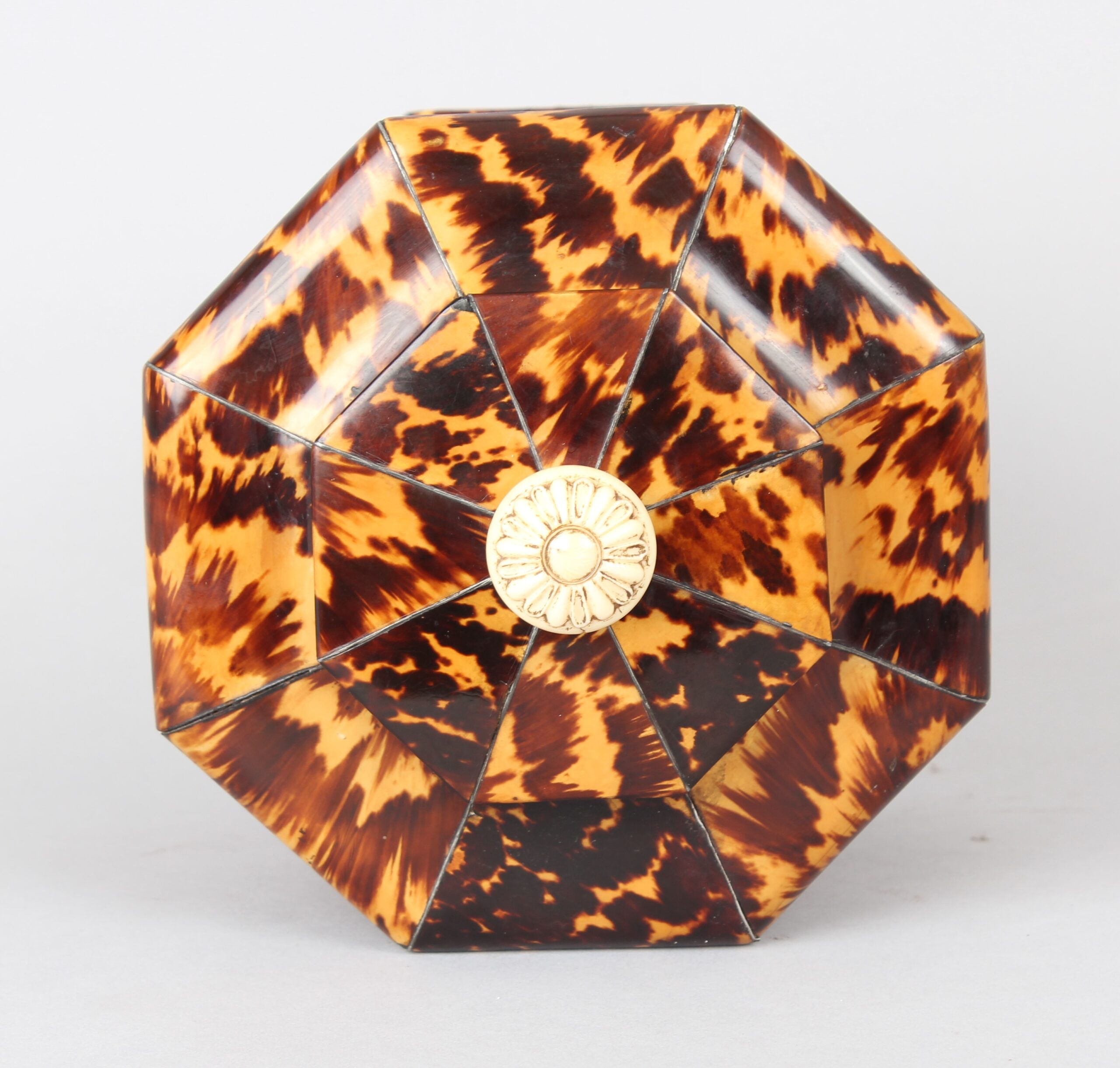 A fine Regency period octagonal tortoiseshell tea caddy