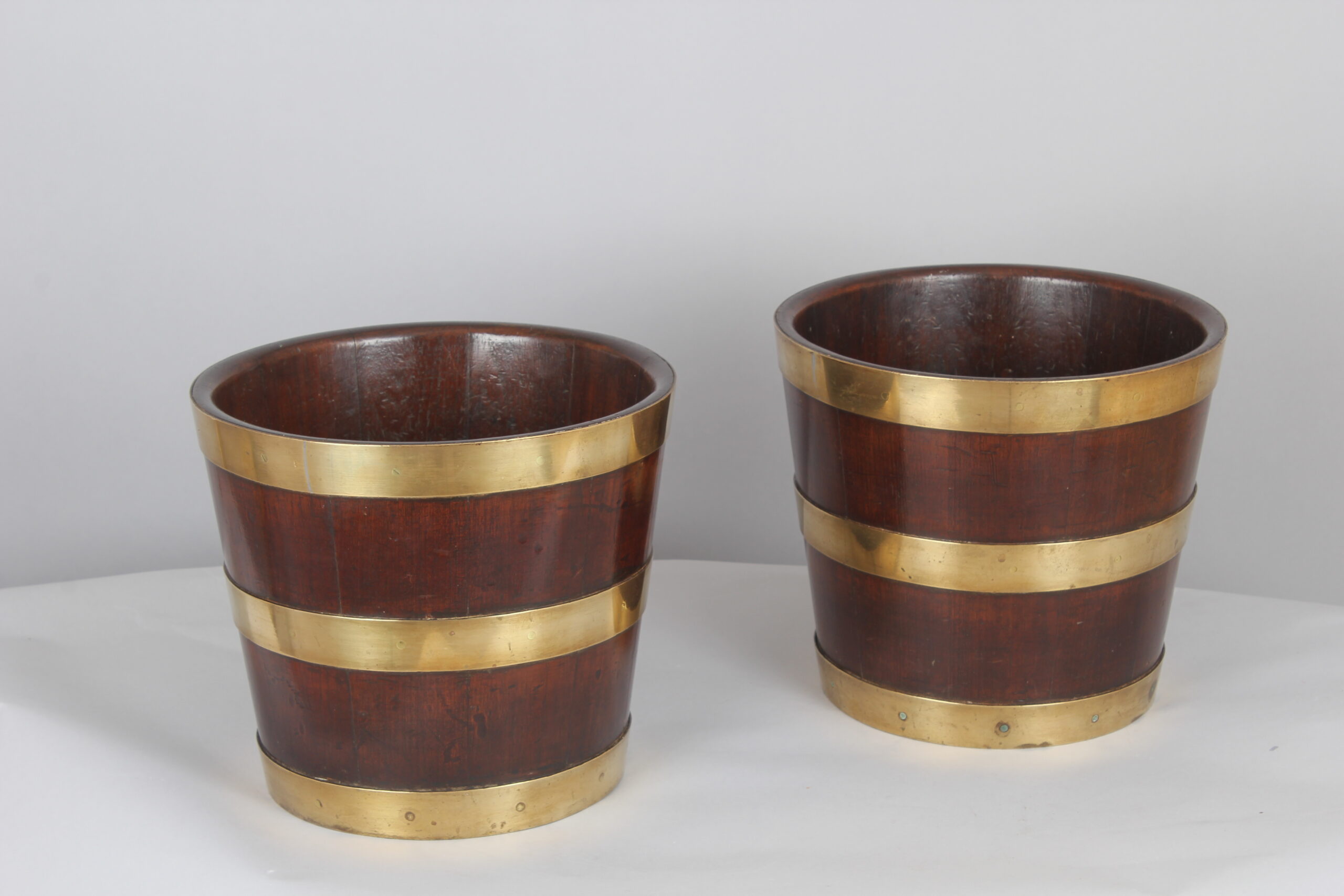 Pair of George III period mahogany and brass banded tubs