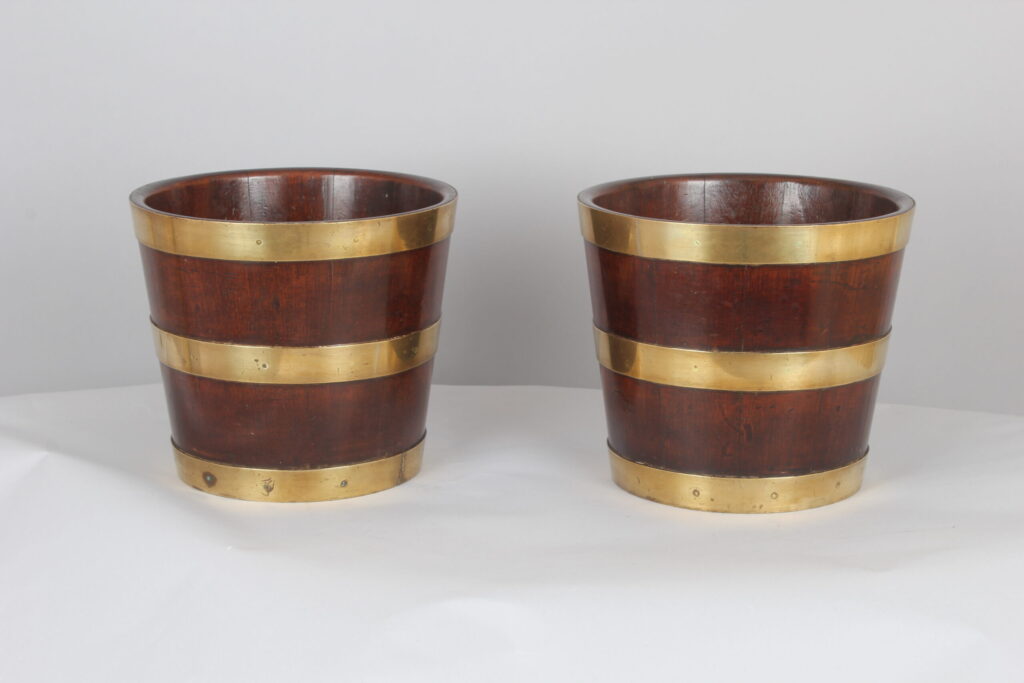Pair of George III period mahogany and brass banded tubs