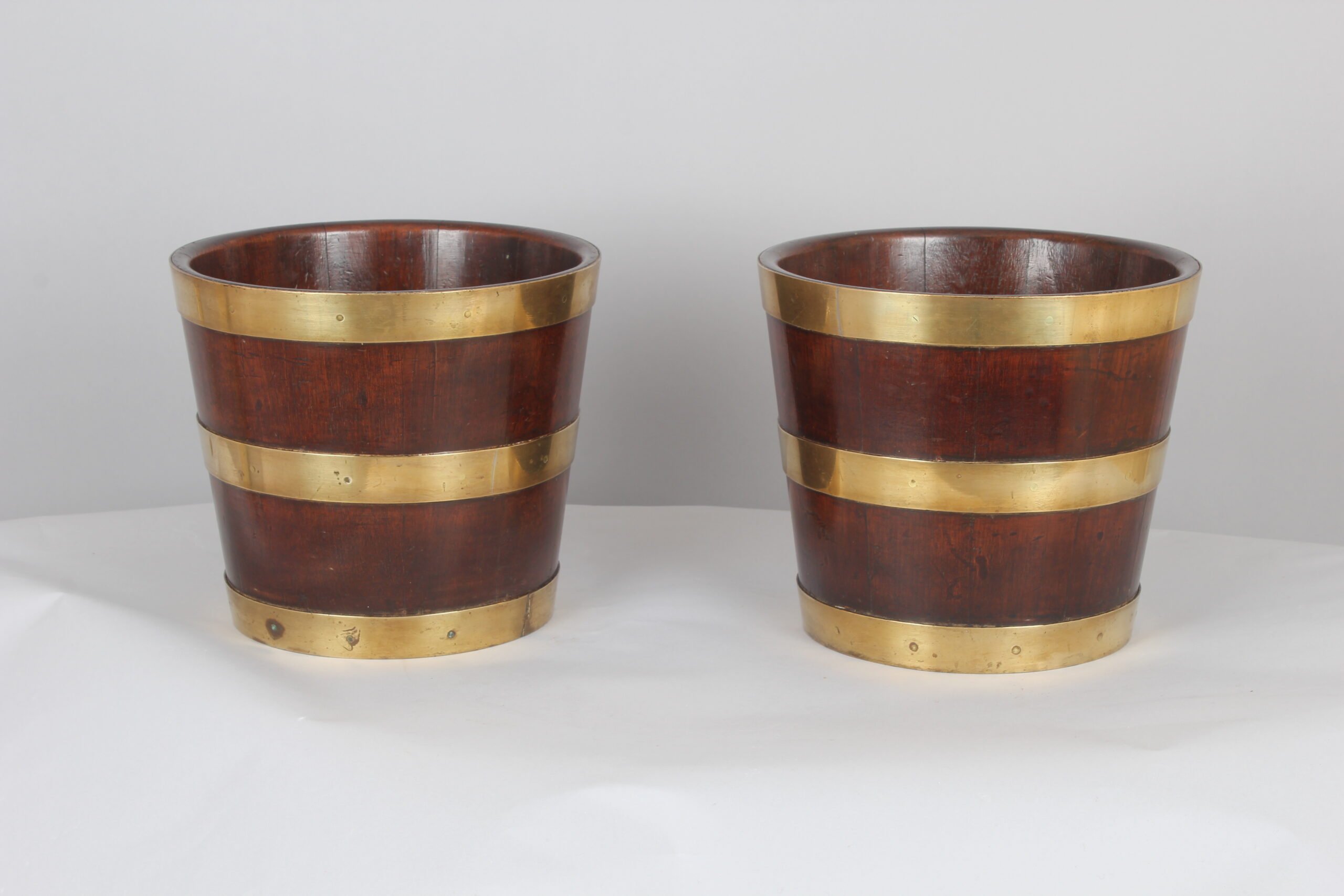 Pair of George III period mahogany and brass banded tubs