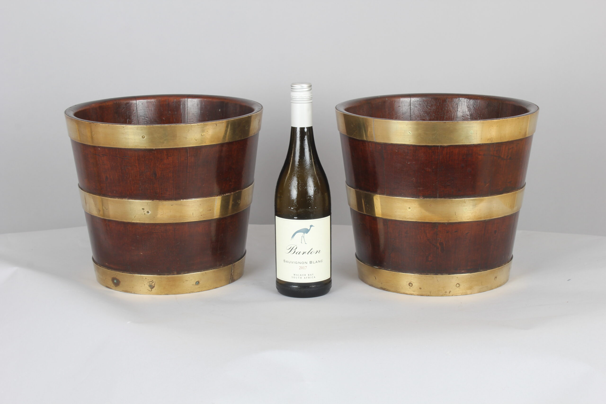 Pair of George III period mahogany and brass banded tubs