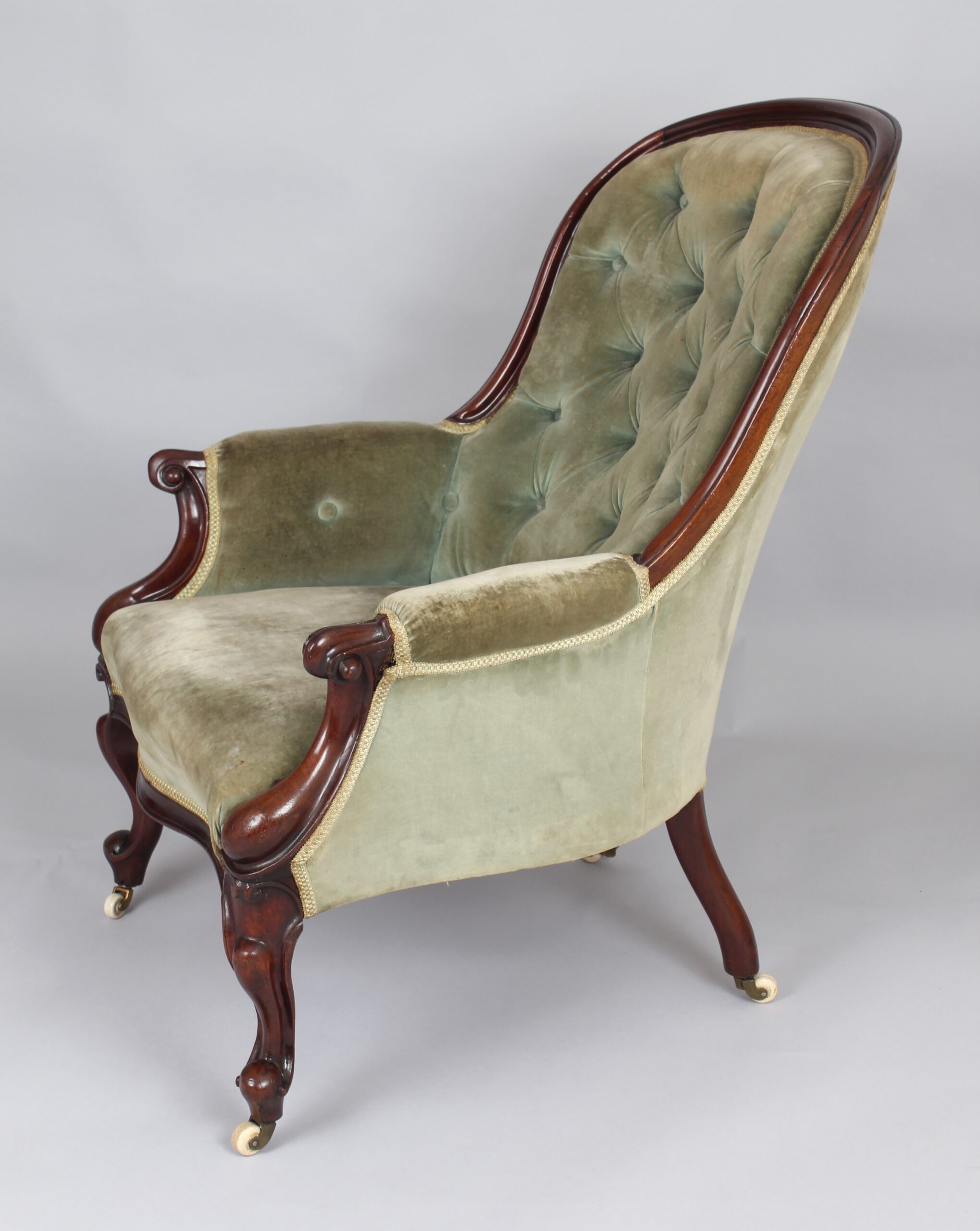 A pair of mid-Victorian easy chairs