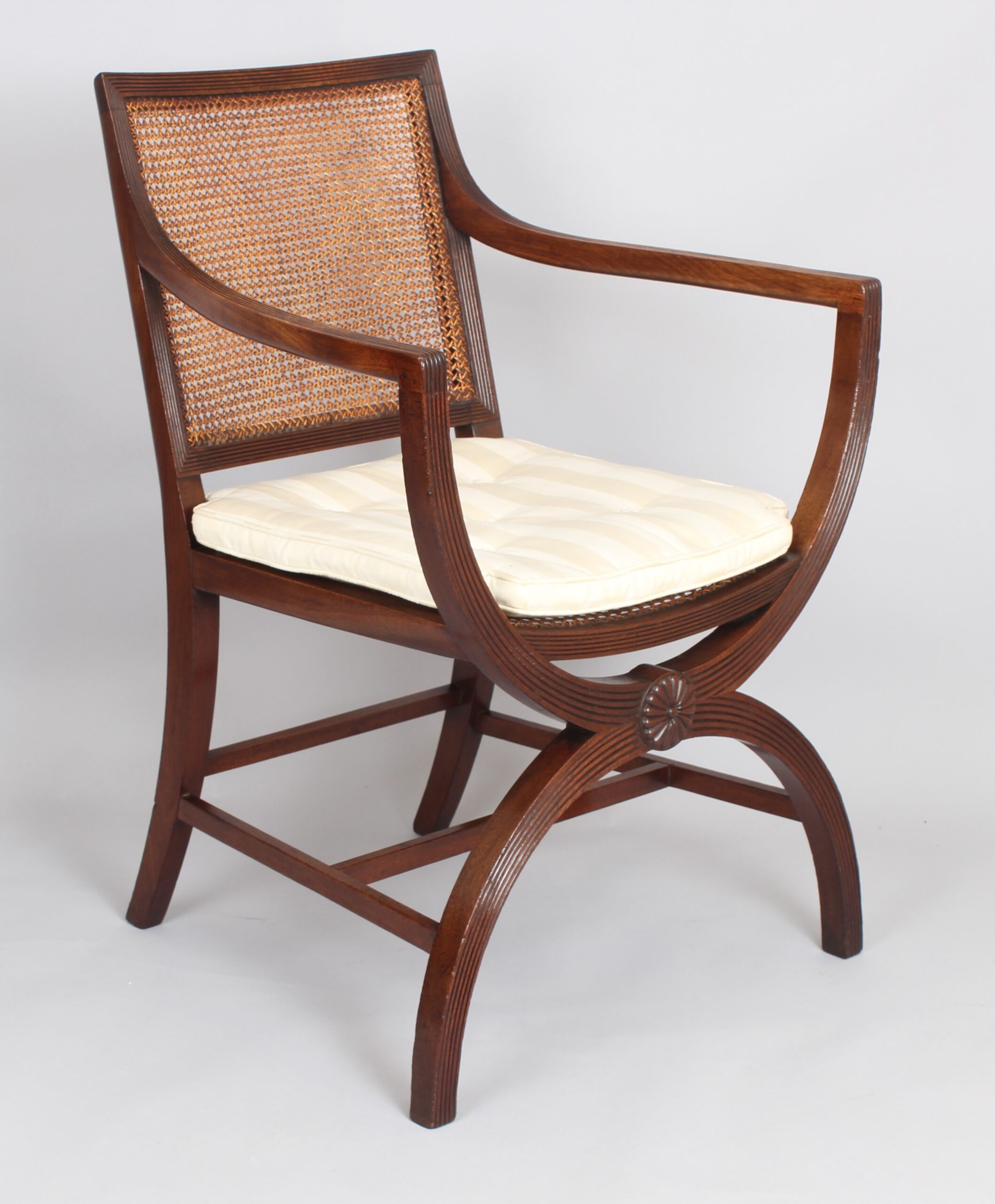 Pair of 19th century mahogany X-framed elbow-chairs of Regency character