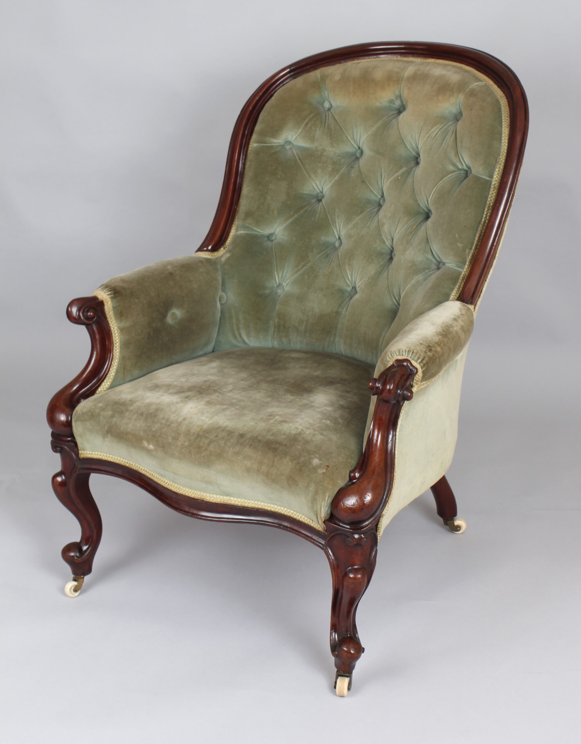 A pair of mid-Victorian easy chairs
