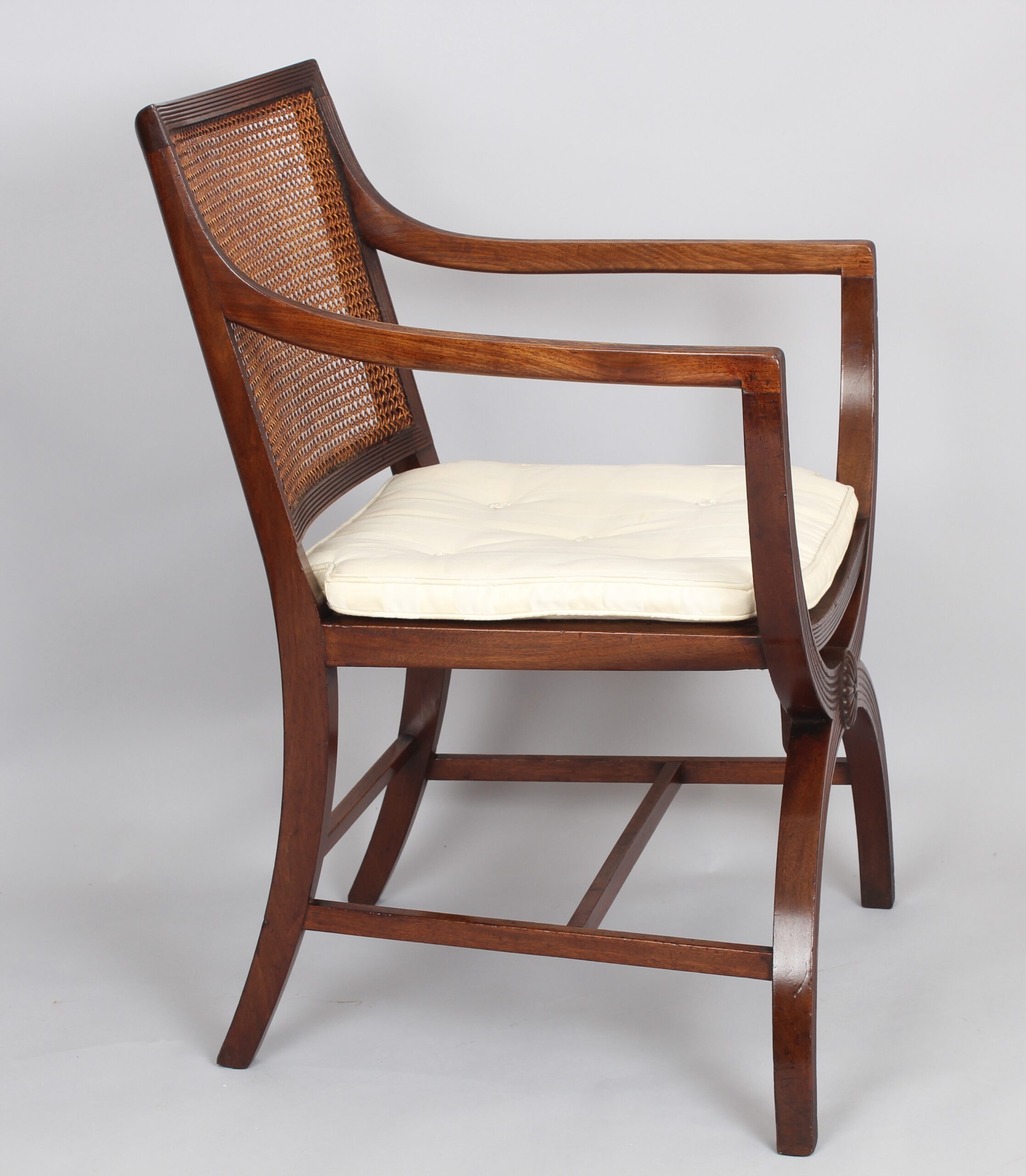 Pair of 19th century mahogany X-framed elbow-chairs of Regency character