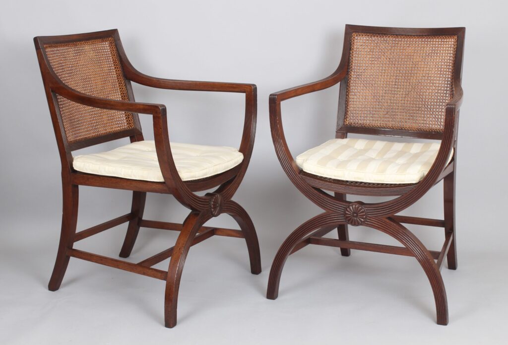 Pair of 19th century mahogany X-framed elbow-chairs of Regency character