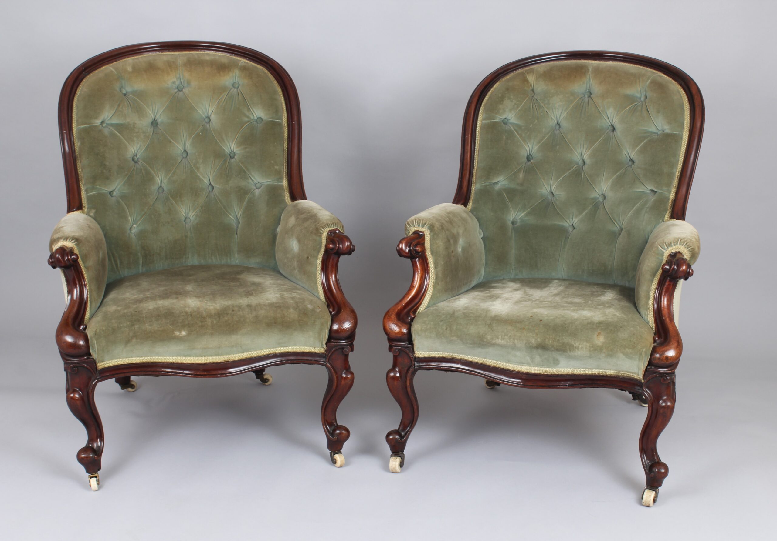 A pair of mid-Victorian easy chairs