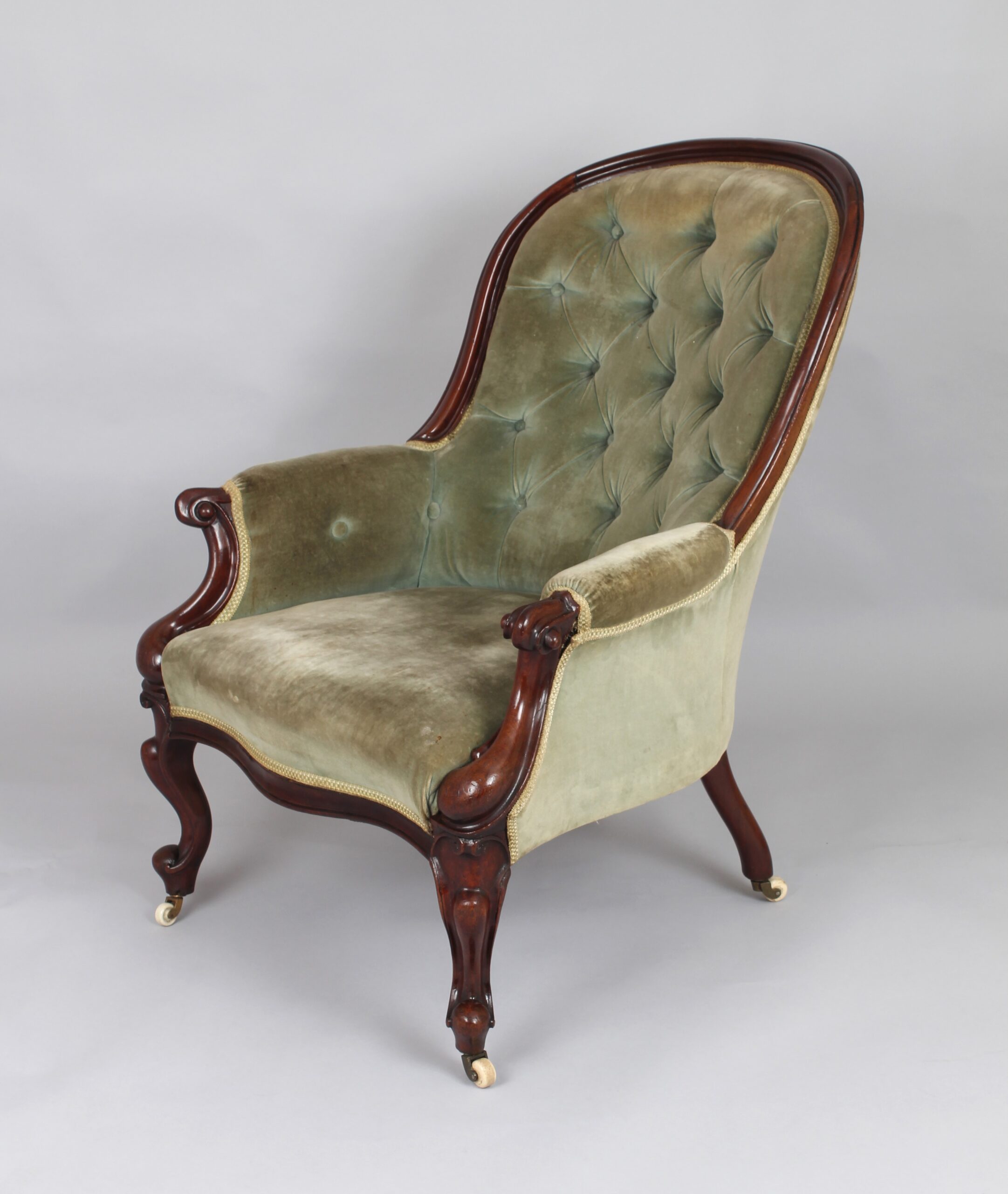 A pair of mid-Victorian easy chairs