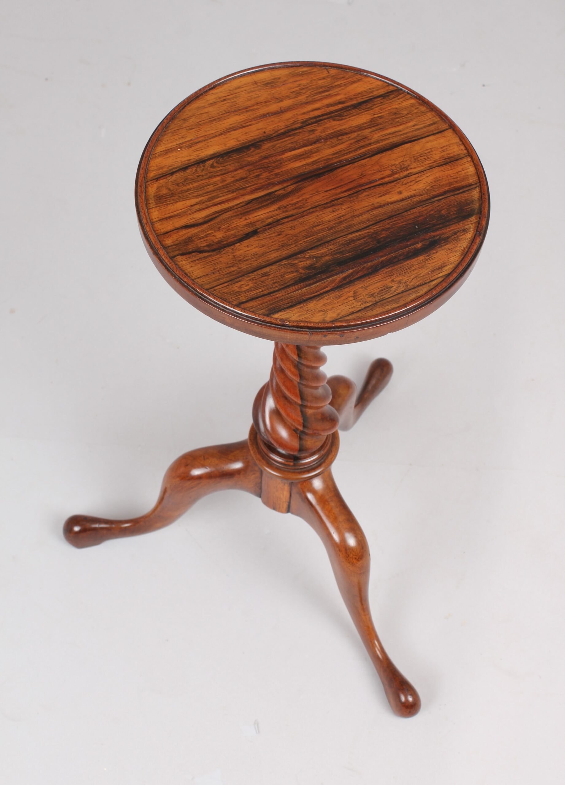 An unusual pair of early 19th century tripod tables