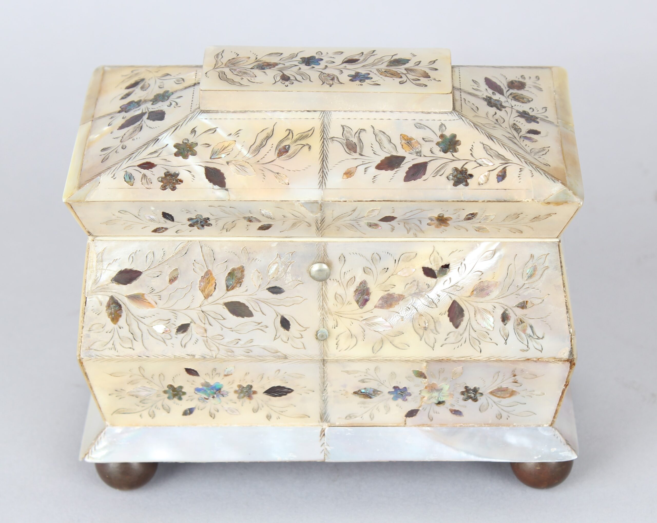 An unusually small early Victorian mother of pearl tea caddy