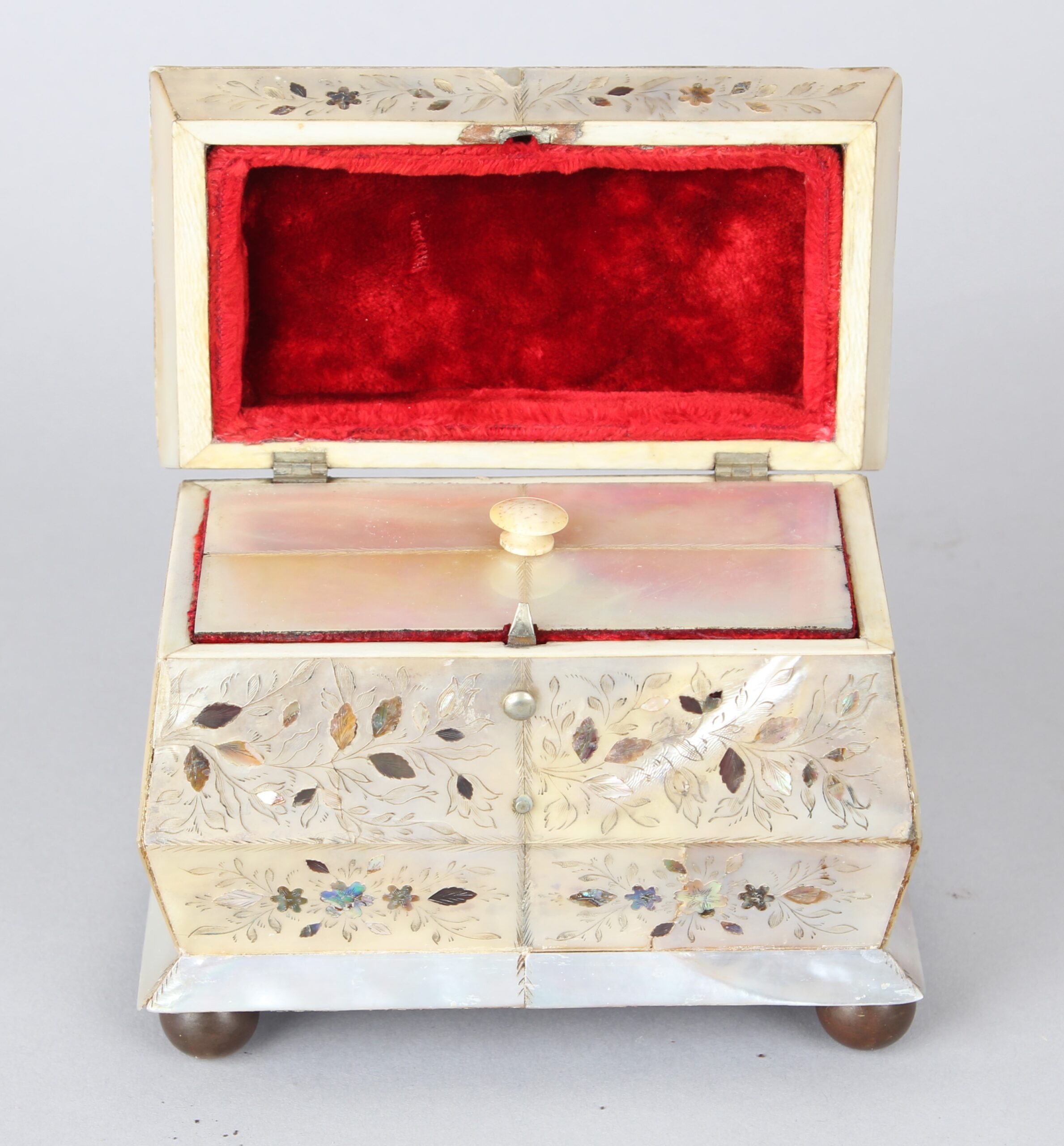 An unusually small early Victorian mother of pearl tea caddy