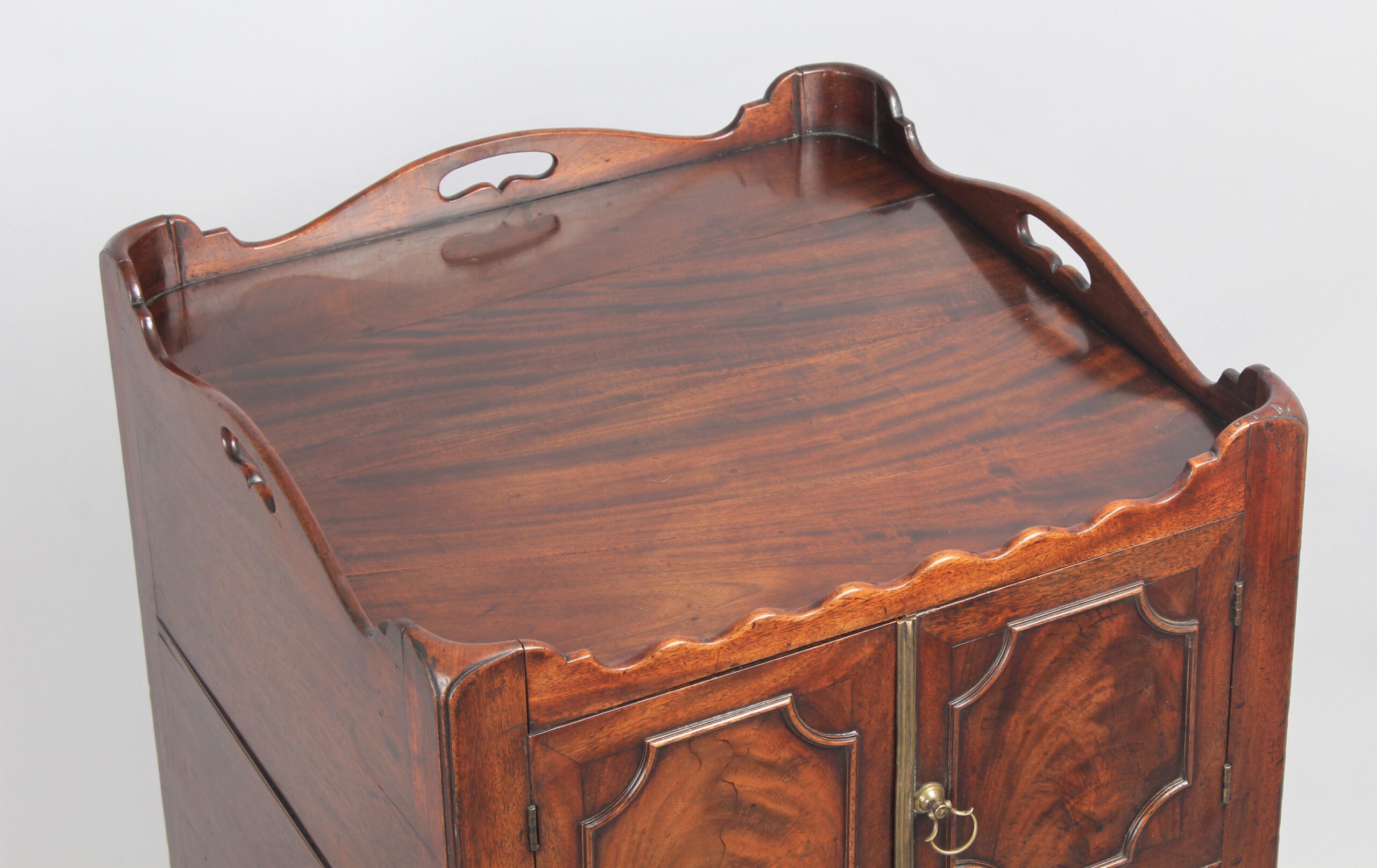 A George III period mahogany tray top bedside commode