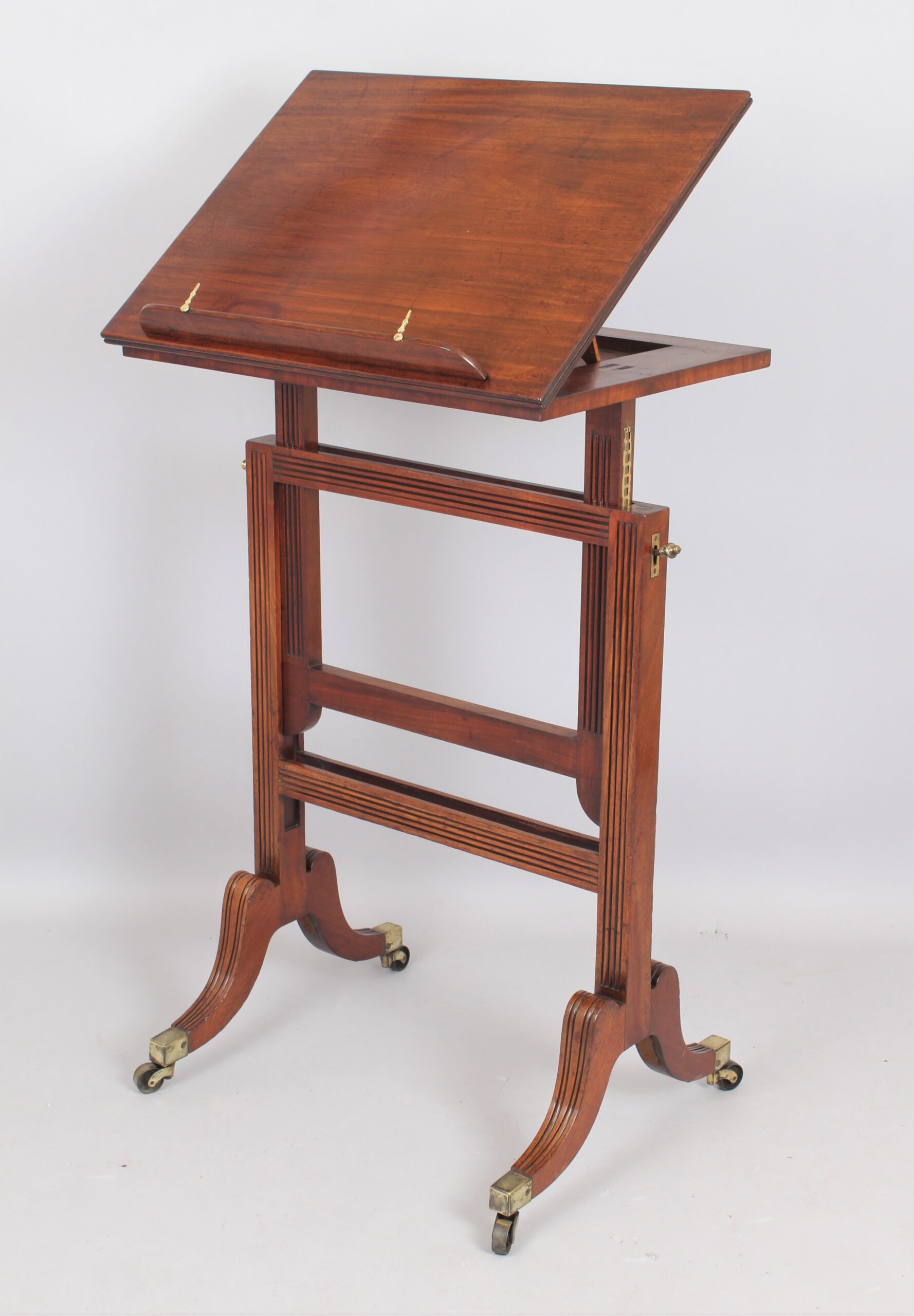 A Regency mahogany adjustable reading table