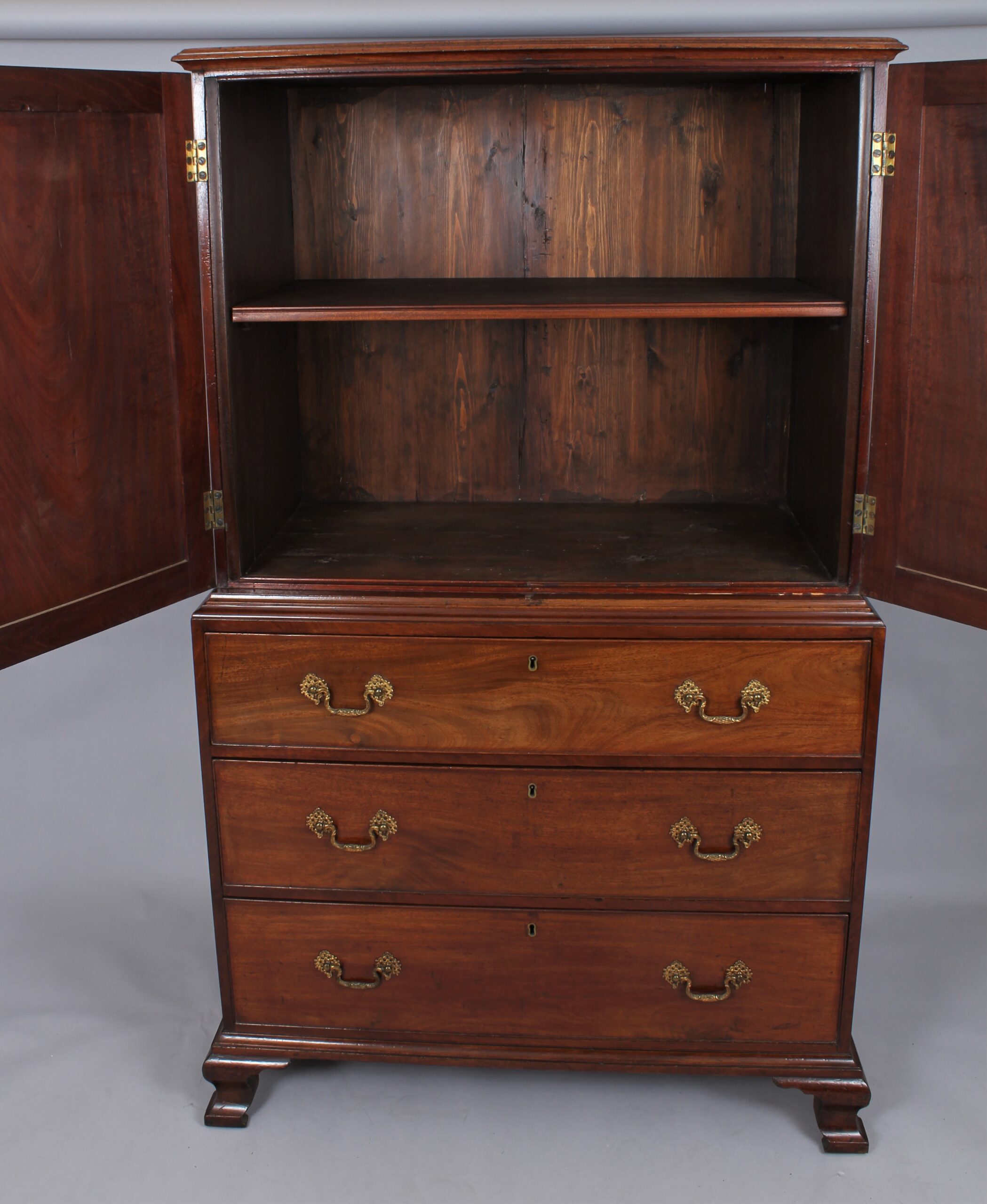 A small 18th century mahogany cabinet