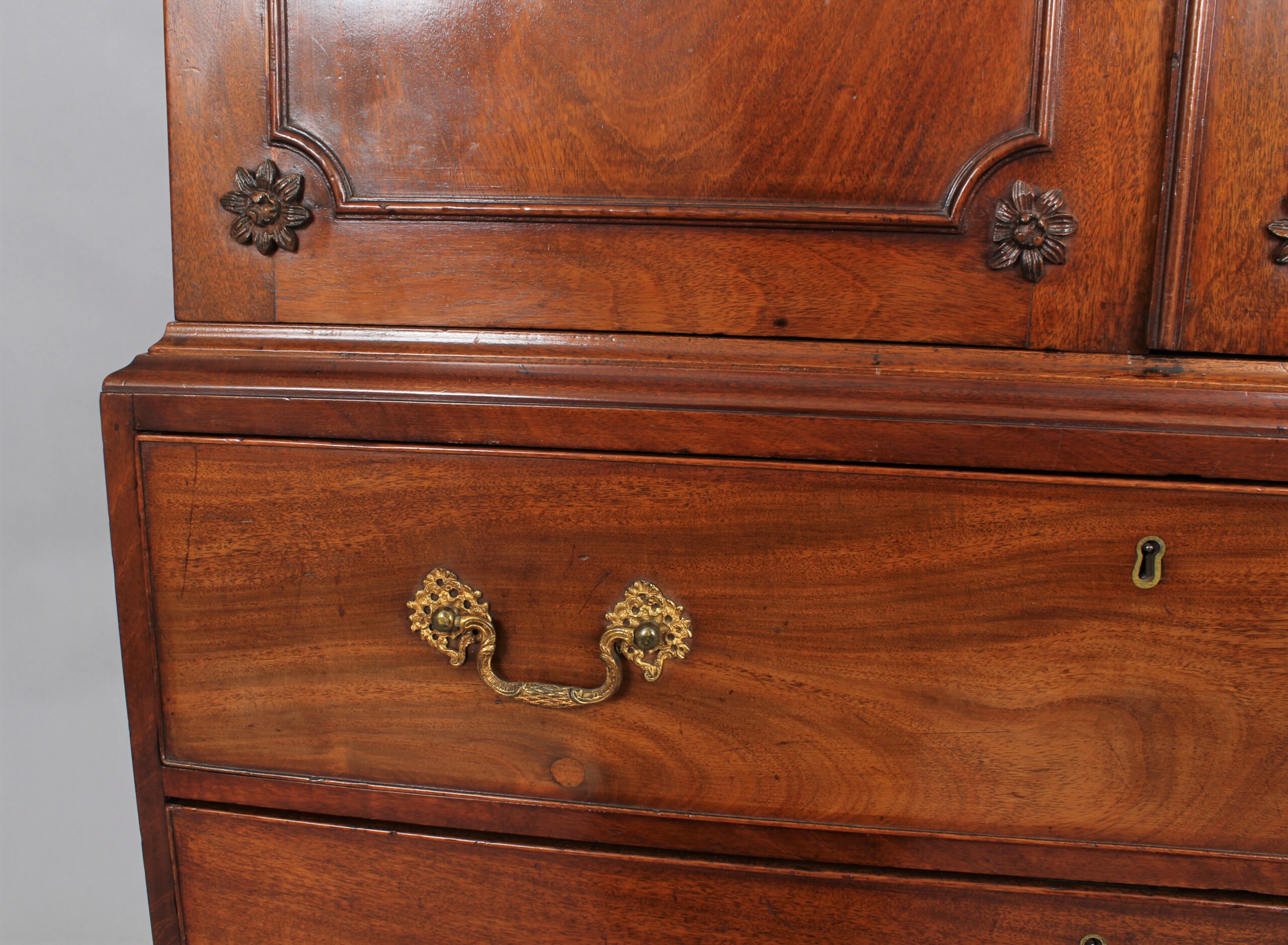 A small 18th century mahogany cabinet