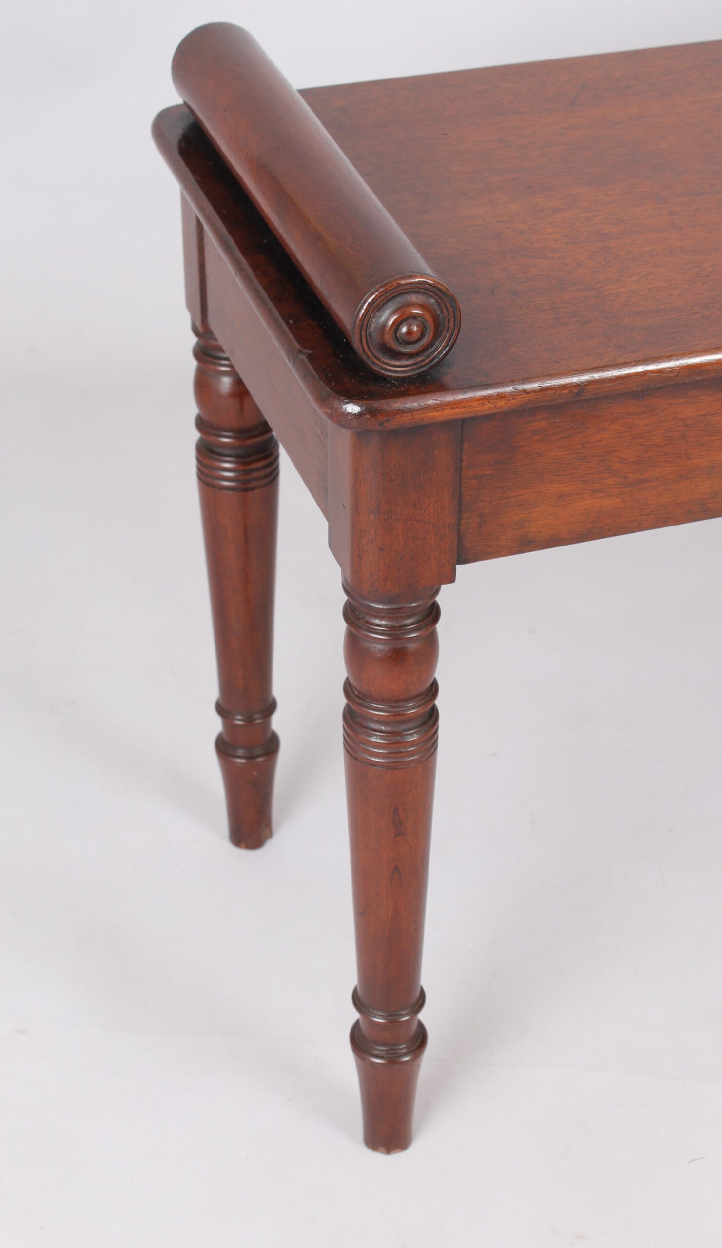 A fine and elegant mahogany hall bench