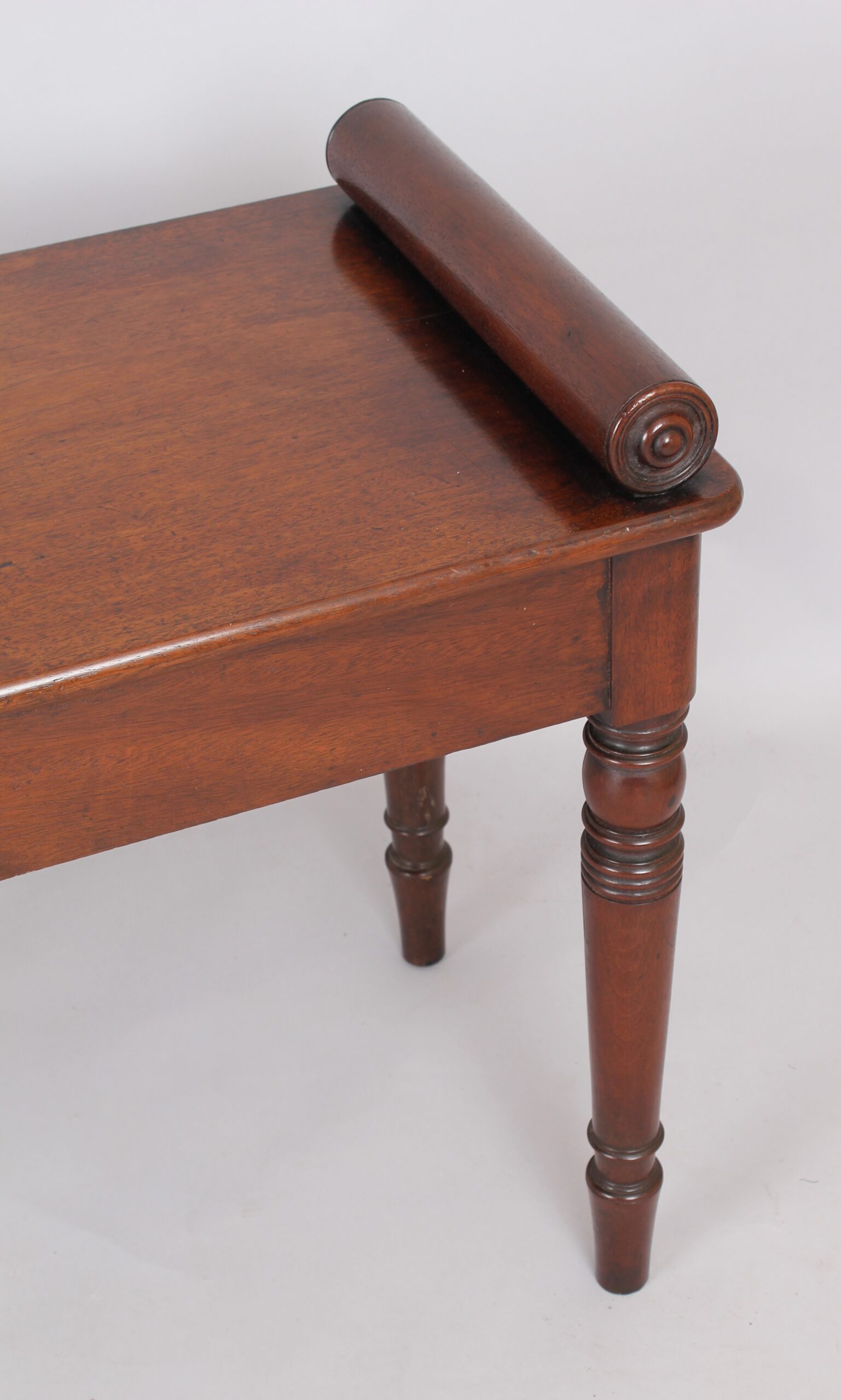 A fine and elegant mahogany hall bench