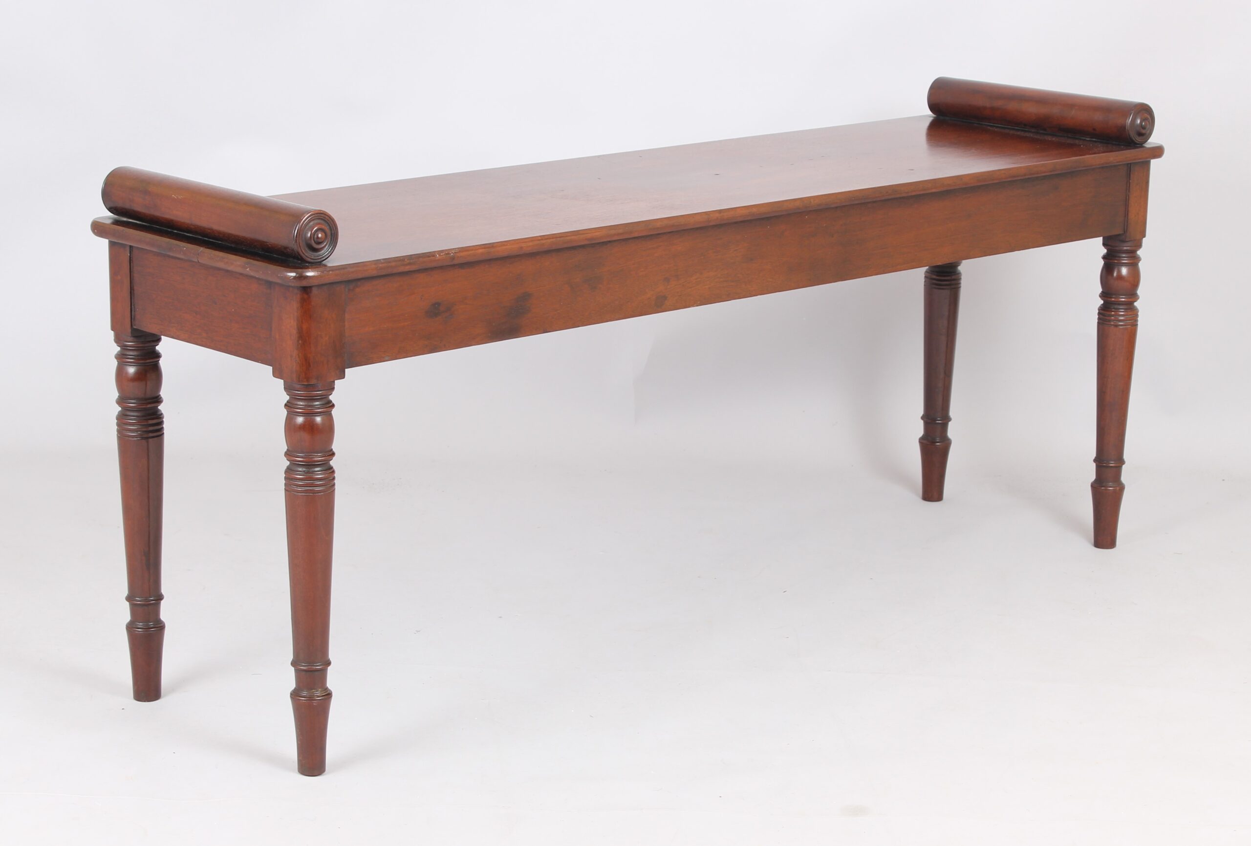 A fine and elegant mahogany hall bench