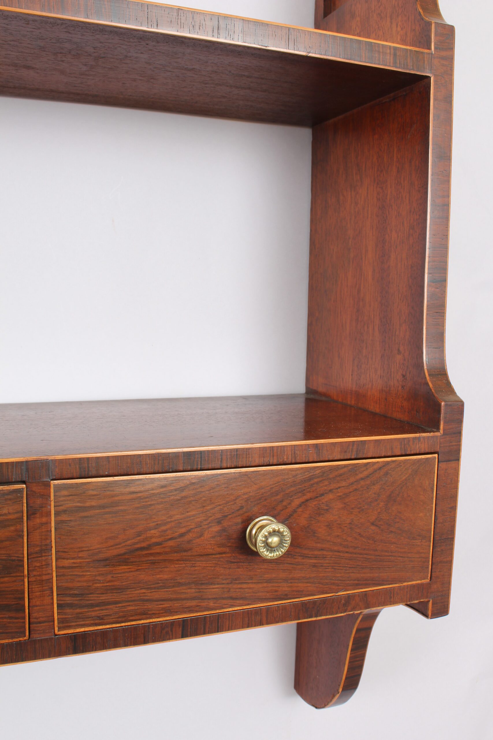 Unusual George III period mahogany hanging shelves