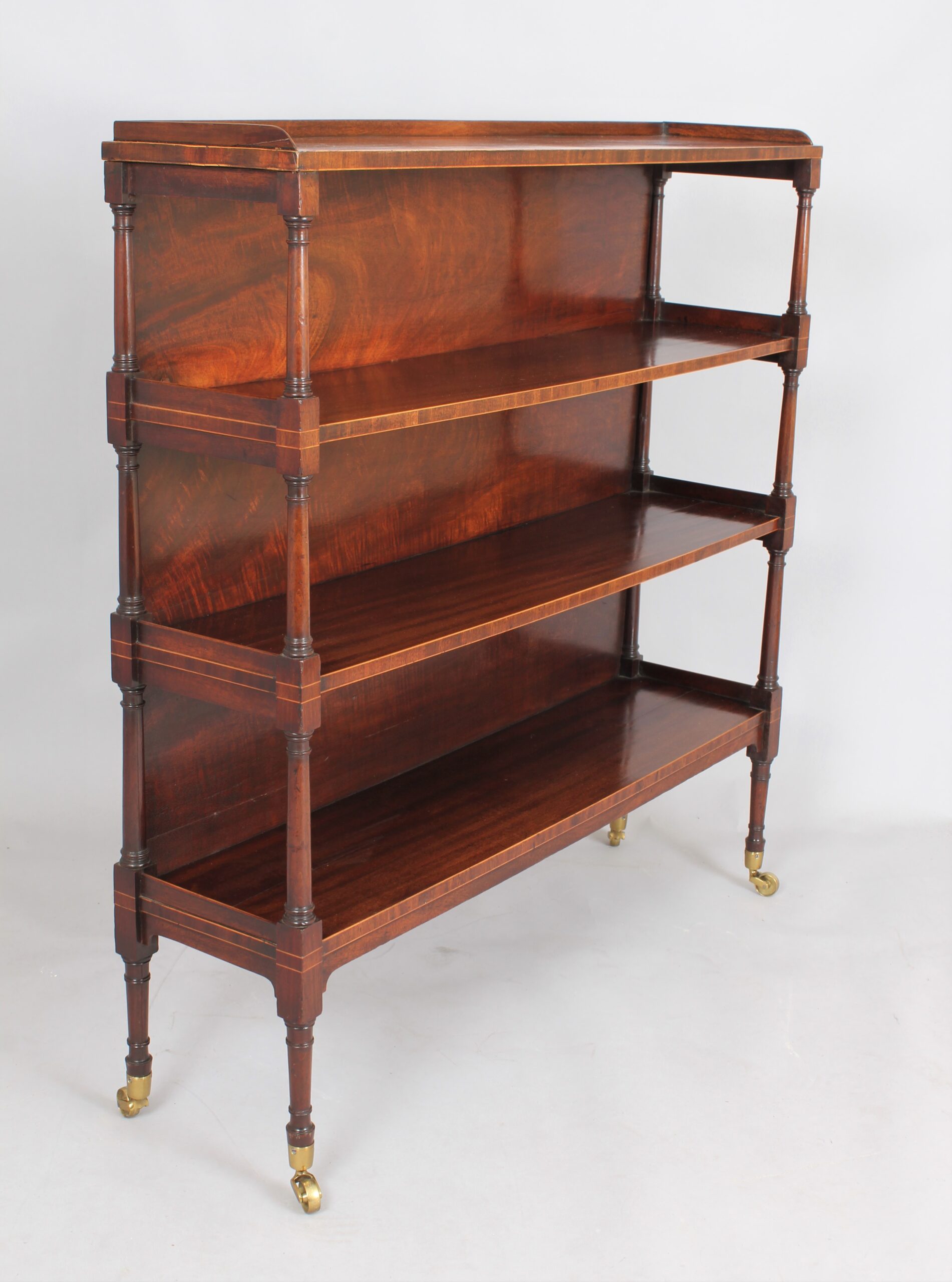 Fine George III mahogany and boxwood strung four tier open shelves