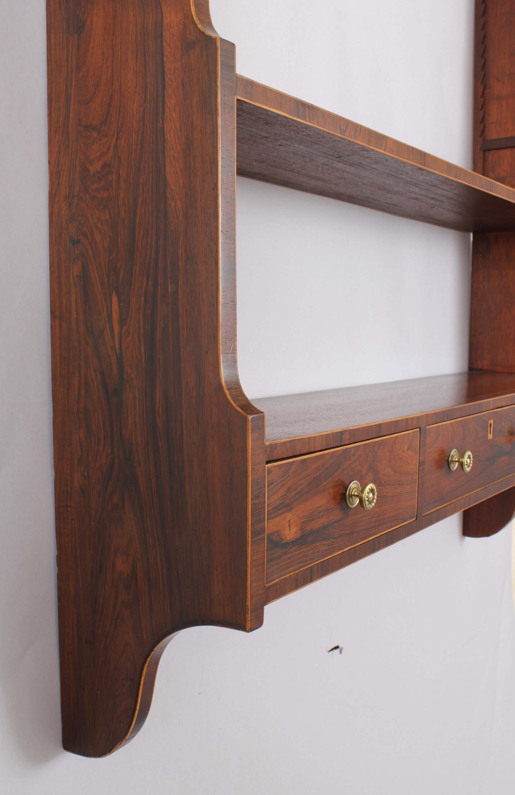 Unusual George III period mahogany hanging shelves