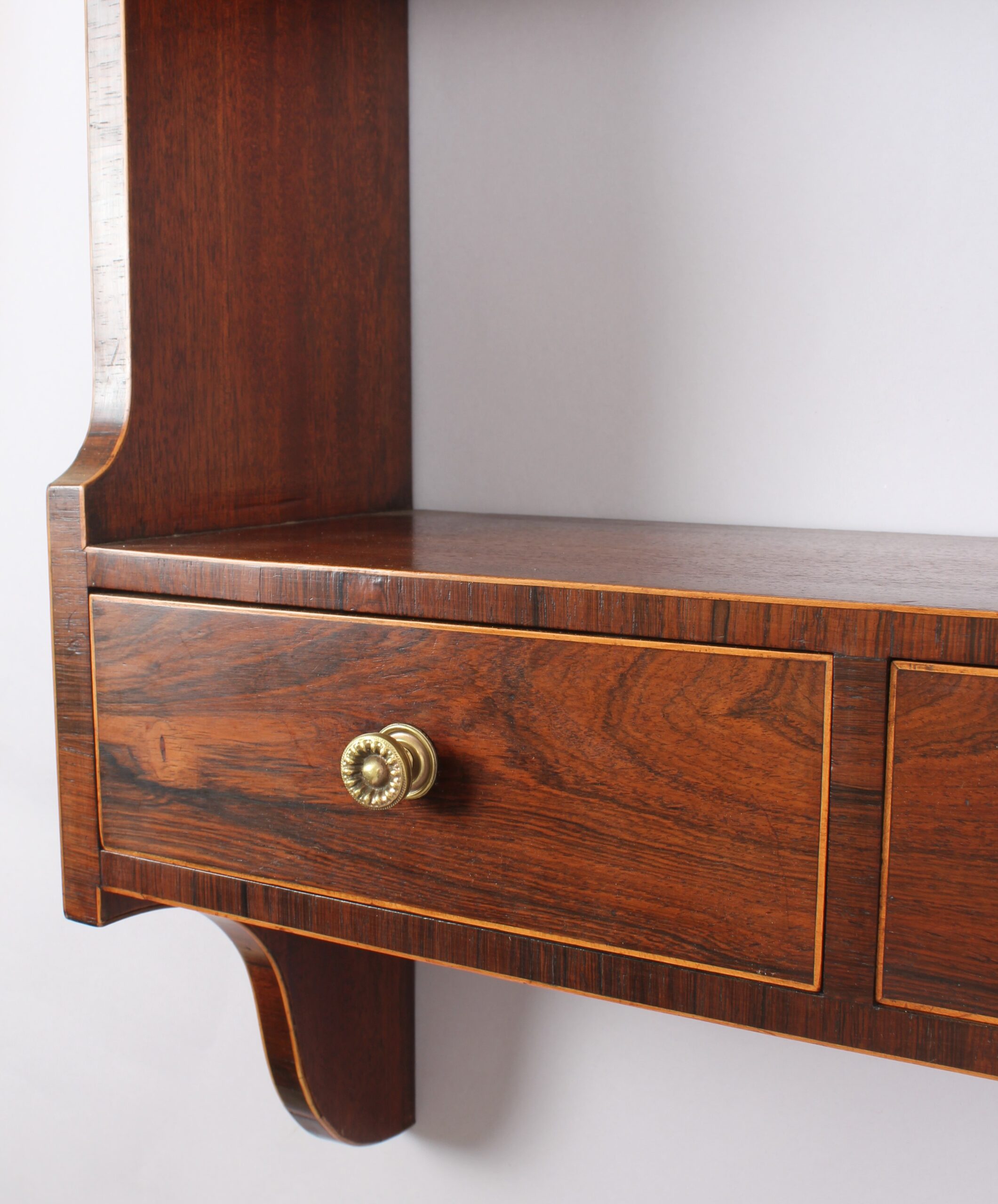 Unusual George III period mahogany hanging shelves