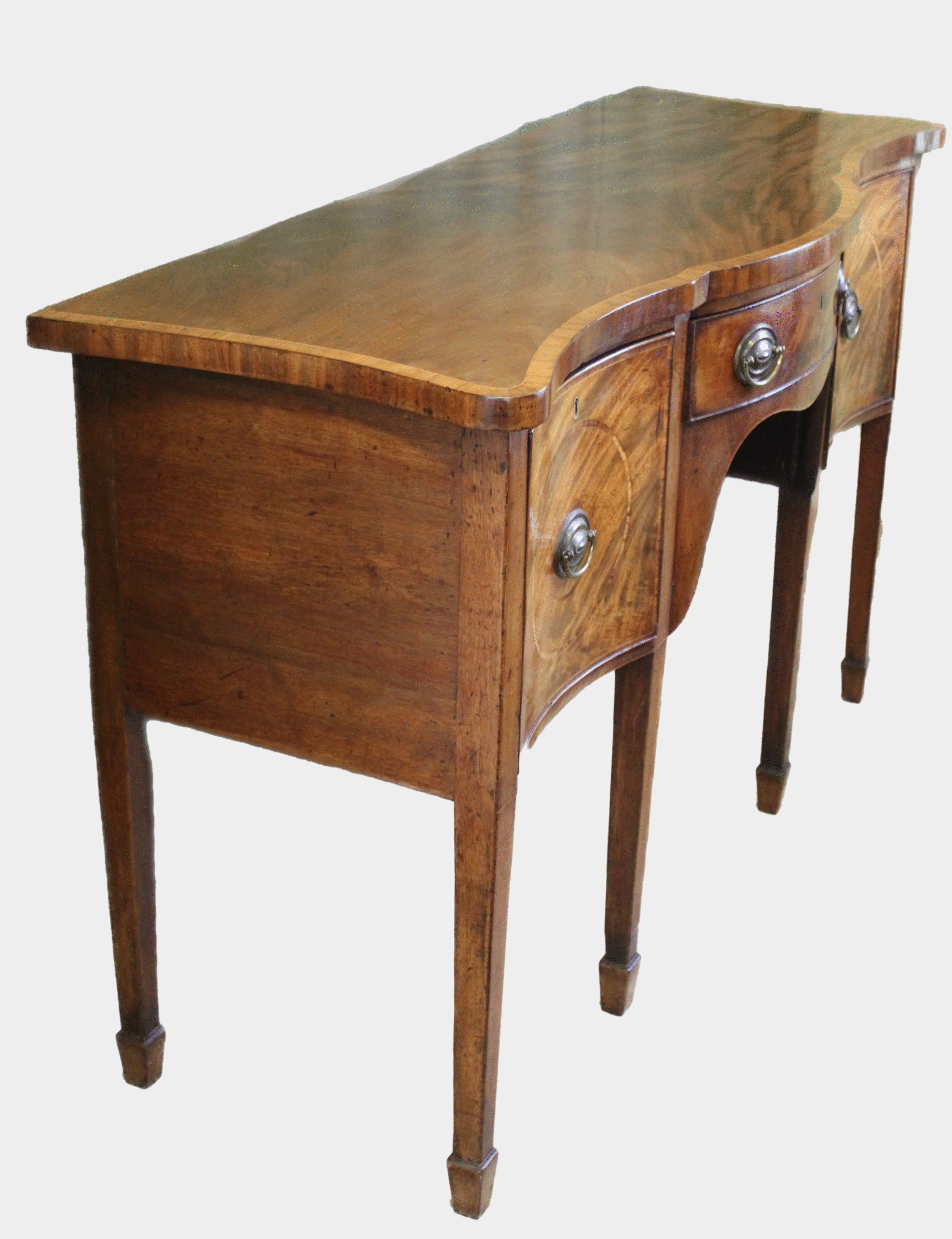 A Hepplewhite period mahogany serpentine fronted sideboard of delightfully small proportions
