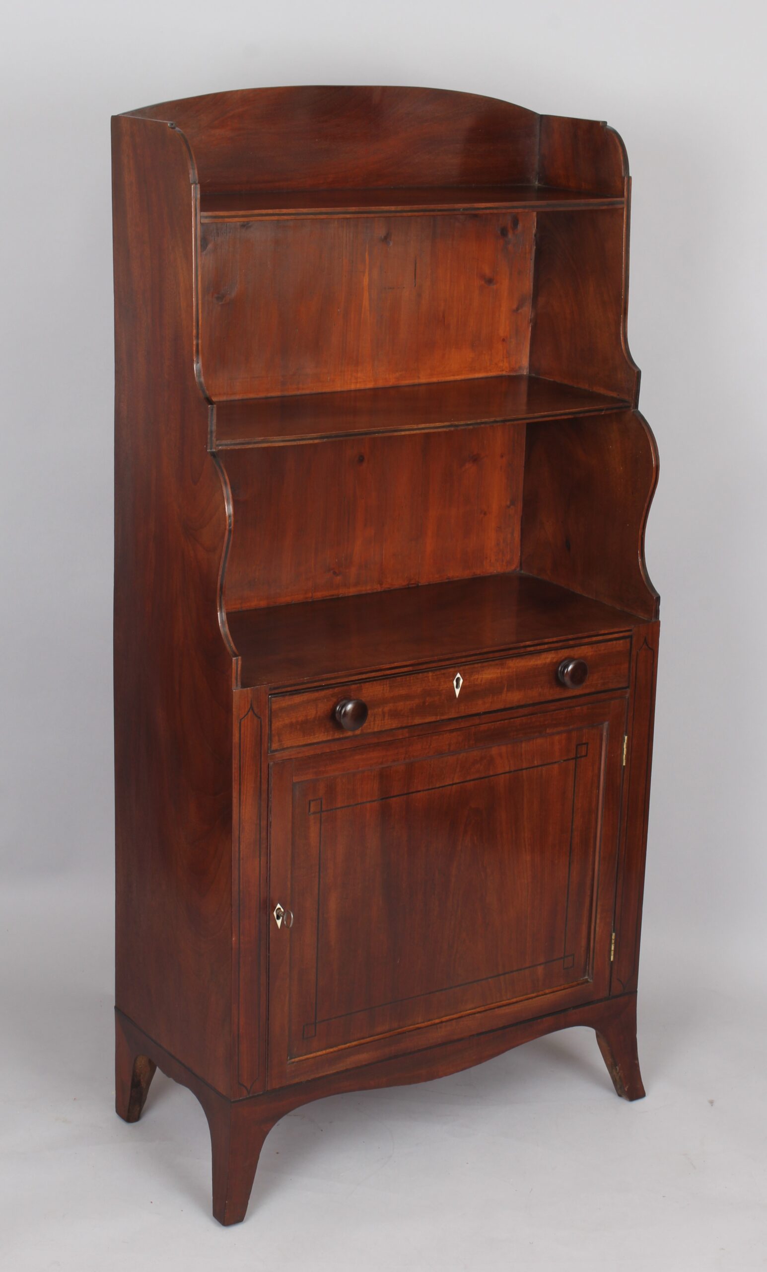 George III period mahogany cupboard base water fall bookshelves